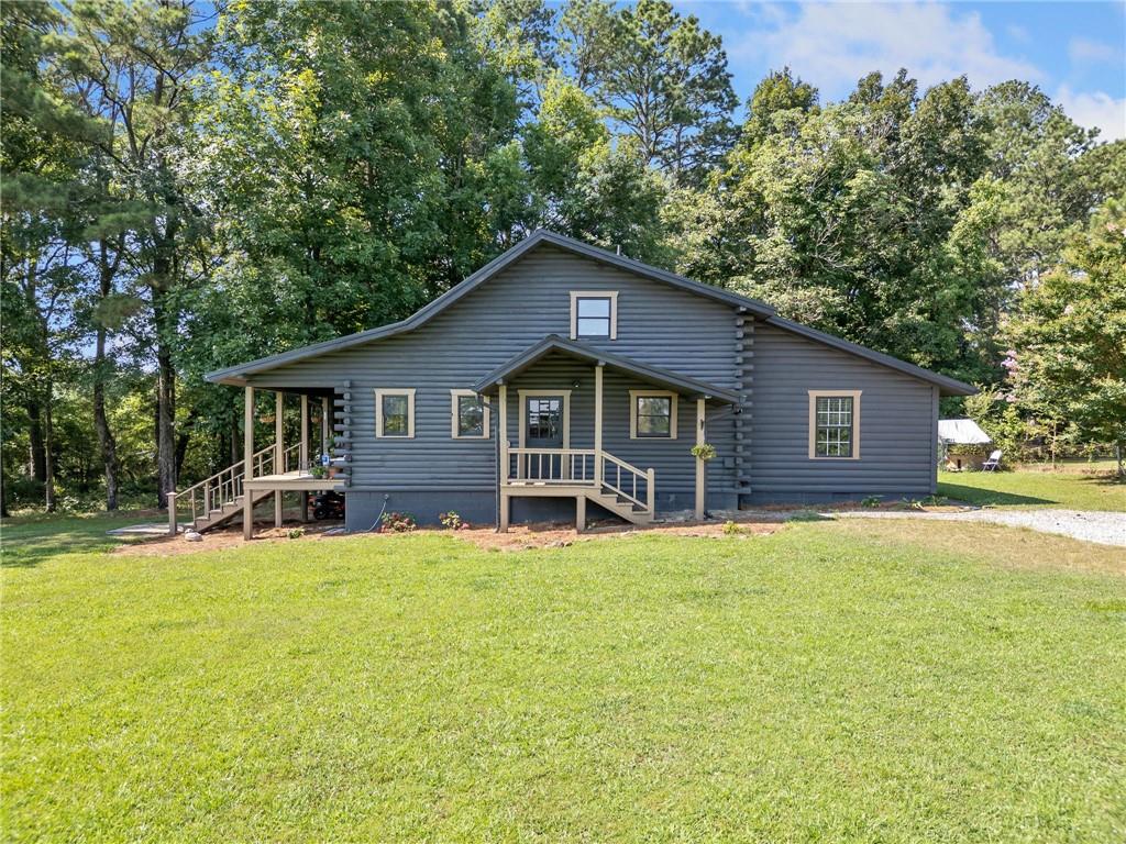 Come home to this Mountain-getaway Cabin or Full-time living in the North Georgia Mountains. No HOA so make it your own Retreat. All roads leading to this property is paved except the 100' driveway. This gem offers a Rocking Chair Porch, Rustic kitchen, High beam wood ceilings, Hardwood floors, Wood walls and doors. Lots of natural light. The two separate flexible loft areas are being used for a bedroom and storage that could easily be transformed to another bedroom and/or office. Other Features: Laundry room and Master on Main. NEW: Carpet, HVAC system, Kitchen flooring, Interior and Exterior paint. 1.67 Acres of ample space of Nature, Outdoor entertainment and Parking: Bring your Farm Animals, Pets, Chickens, RV, Work Truck, ATV, and other toys. If you're ready for your next chapter as Nature lovers and Comfort seekers, then don't hesitate to purchase and hold the keys to this one!