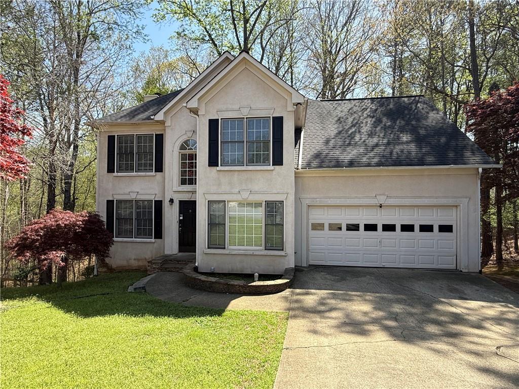 Must see three story home in Deer Run located in Woodstock Georgia! This 4 bed, 3.5 bath home is a can't miss with tons of unique attributes, screened in patio and full length back deck! Located on a cul de sac this home has well maintained exterior, two car garage and driveway. Inside a two story foyer greets you with views into the formal living and fireside family room. Dark laminate flooring on the main is an added bonus. Gas fireplace at the center of the family room has a large wooden mantle. Kitchen has stained cabinets, granite counters and breakfast bar. Laundry room and pantry each have their own area. Dining room off the kitchen has enough room for all! Screened in back patio overlooks the yard with sky lights. You feel like you are in a tree house overlooking the yard. Upstairs includes primary suite with tray ceilings, private bath, double vanities and separate tub/shower. A bonus loft upstairs makes the hallway open and light. Two more well sized bedrooms make up the second floor and share a full bath. Downstairs includes full finished bathroom, wet bar, full bedroom, huge living room with tray ceilings and access to the full length back deck! Located in a swim/tennis community!
