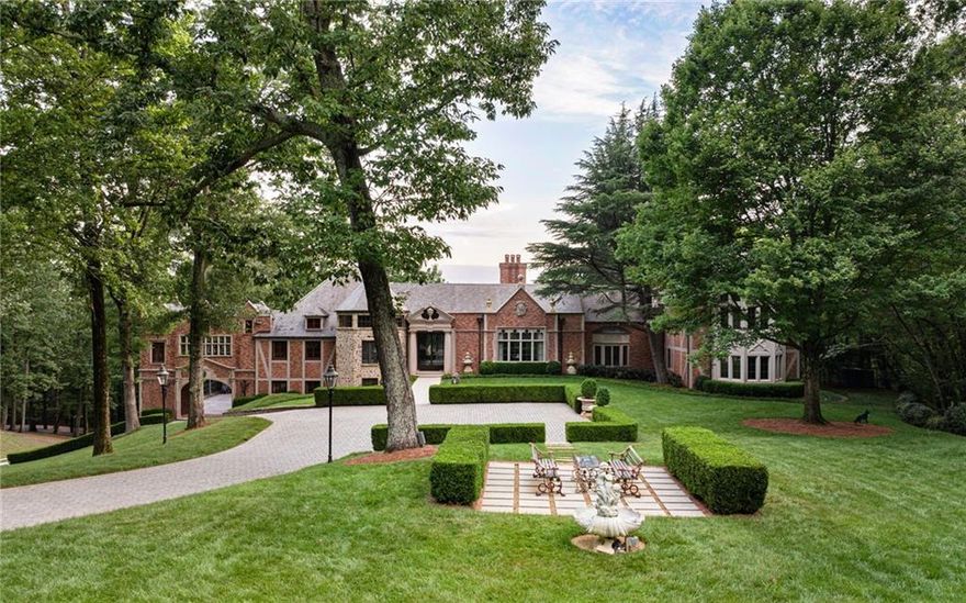Majestic gates open to showcase a 17,000 square foot limestone and brick European inspired mansion that is strategically perched in the middle of the very private 18-acre property. The stunning architectural detail of the home exudes unparalleled grandeur and opulence, where no expense has been spared. 19th c. Parisian double entry doors open to an awe-inspiring art gallery that is magnified by a 19-foot plaster ceiling carved in the manner of the Braccio Nuovo Wing of the Vatican Museum. The centerpiece gallery spills out into an enormous Jerusalem limestone balcony with bespoke balustrades overlooking breathtaking grounds dotted with rare Chestnut Oaks and even more rare 18th and 19th c. curated statuary. This fanciful setting was once the site for a lavish wedding scene featured in the updated Dynasty TV series. Other productions such as "Black Adam" and "Ironheart" also chose Chestnut Hall as a venue for their films. There are seven remarkable and generous ensuite bedrooms, including a 2,400 square foot primary suite that encompasses an entire floor. As with the bedrooms, all living areas are spacious and resplendent. Whether it is the 16-seat dining room or custom-built kitchen with two oversized islands that flow into the breakfast area, or the lower level that features a four-room gym and spa with commercial grade selectorized equipment, barbells, dumbbells, boxing set up and a spa with steam, sauna and a massage nook, there is no skimping on space. Certain photos, however, do not capture the scale of some rooms due to camera limitations. Thus, the adage, “Photos do not do it justice.” There is an additional four-bedroom guest house and one-bedroom pool house with a full bathroom and kitchen. Every comfort and luxury has been accounted for at Chestnut Hall, including a state-of-the-art smart home control system, a full house generator and an advanced Rainbird IQ system that allows you to program landscape irrigation remotely on your mobile device. You can spend hours enjoying a large swimming pool with an 8-person jacuzzi, basketball court and baseball setup with every detail in perfect order. Chestnut Hall is a short drive to acclaimed schools and universities, iconic shopping, fine dining, museums, and sporting venues. The estate is move-in ready with every detail in perfect order. Chestnut Hall is a one-of-a-kind masterpiece that cannot be replicated and offers a once in a lifetime opportunity to a sophisticated buyer.  Offered fully furnished which includes investment quality antiques and rare tapestries, fireplace surrounds and antiquities artfully placed throughout the home, blended beautifully with contemporary furnishings to provide a one-of-a-kind eclectic collection.