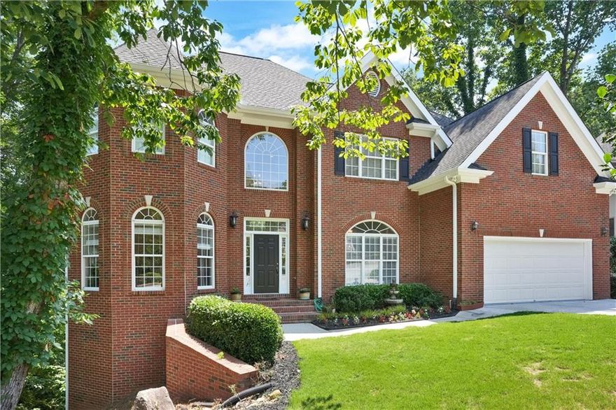 A gorgeous four story House you must see! This one of a kind, Move-in ready builder’s home is located in Nesbit Lakes subdivision, The highly coveted swim and tennis community in Alpharetta, This three side brick house has three HVAC, Irrigation system and two water heaters 50-gallons each. The house is nestled in a peaceful cul-de-sac at the end of a quiet street bursting with natural beauty. 
Home has eight Bedrooms with breathtaking views, five full bathrooms, and a fully finished daylight basement. The main floor features a bright open concept with tray ceilings, crown moldings and hardwood floors throughout, a two-story foyer, large dining room and formal living room, as well as an office with built-in bookcase and an attached full bathroom. The two-story great room has built-in bookcases, framing a marble gas fireplace. The bright open kitchen has beautiful stained cabinets, an island with built-in storage, pantry, granite countertops, double oven and a breakfast area opening to spacious outdoor deck. great for relaxation and entertaining friends and family. 

The spacious Primary Suite on the second floor offers beautiful tray ceiling, a gas marble fireplace and large windows. Primary bath features-stained double Vanities, a separate shower, a large jacuzzi for two and a huge walk-in closet. The second floor includes three additional bedrooms and two full bathrooms. 

The fully finished daylight basement has a separate entrance, a full kitchen with stained cabinets and granite countertops, large pantry, full bathroom, three additional bedrooms, an exercise room and a huge family room with tray ceilings and a third brick gas fireplace, all opening to a large deck overlooking a beautiful view of tree-lined view that offer complete privacy. An unfinished daylight sub-basement offers extra storage/hobby space. 2 car garage at kitchen level to park 2 cars. 

Neighborhood amenities include a clubhouse, six tennis courts, swimming pool, splash park, playgrounds, grills, side walks, pickleball, two fire-pits and lake to enjoy fishing. This Neighborhood has it all!

The owner of the house is a real estate licencee under the law of Georgia.