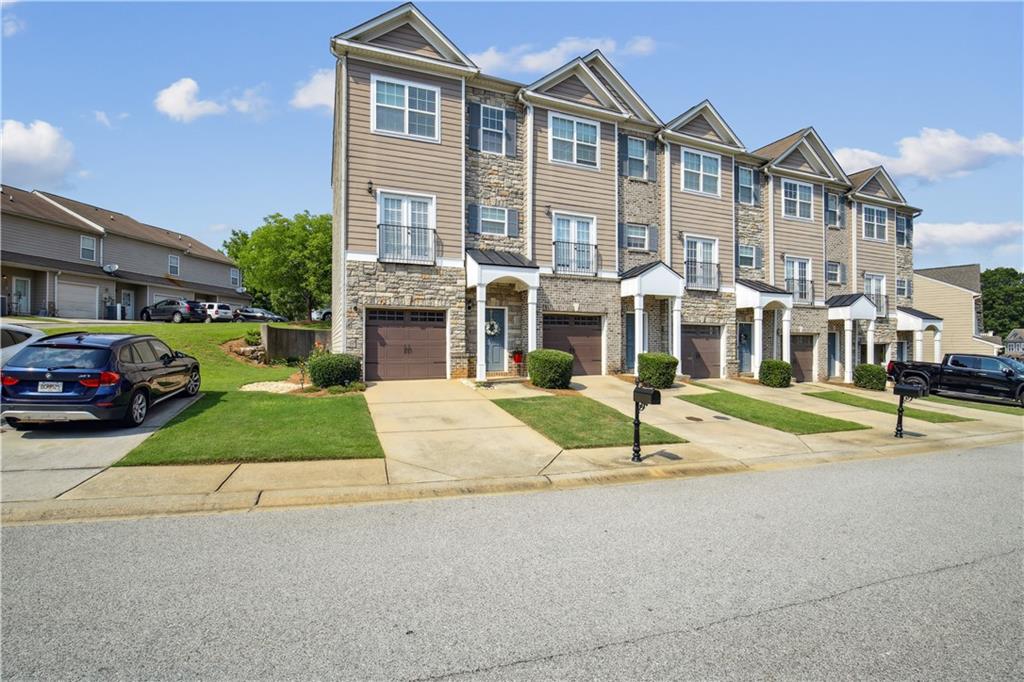 Discover this fabulous three-story townhome, an end unit conveniently located to two overflow parking spaces, nestled within the desirable Renaissance at South Park Community. Tthis home offers a spacious primary bedroom complete with a sitting area. Its unique floor plan features two additional guest rooms, each with its own full en-suite bathroom. Ideal for flexible guest accommodations or work from home. The bright kitchen and breakfast area welcome natural light. This is the perfect location, just minutes from the Atlanta International Airport, Atlanta Metro Studios, and Peachtree City.