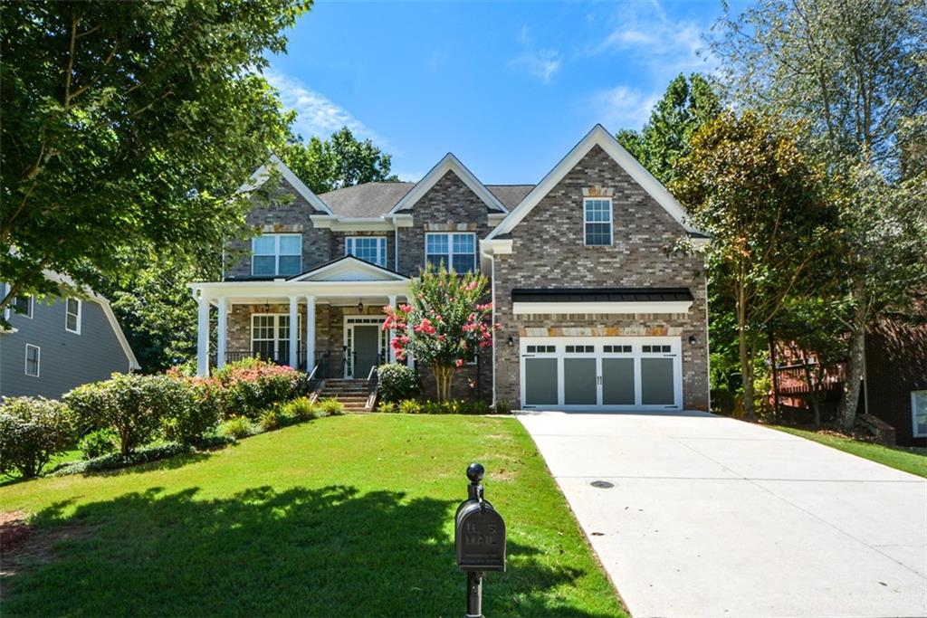 Nestled in a quiet, well-maintained neighborhood, this 6-bedroom, 5-bathroom brick beauty offers a rare combination of space, style, and location. Boasting over 5,000 square feet of finished living space, including a completely finished basement, this home has been thoughtfully designed and meticulously maintained — move-in ready and loaded with premium upgrades. From the moment you arrive, you'll be impressed by the home’s classic curb appeal, with its stately brick façade, welcoming front porch, manicured landscaping, and carriage-style garage doors. Inside, you'll find granite countertops, high-end trim work, and quality finishes throughout, creating a refined yet comfortable atmosphere. The main level features hardwood flooring, an open-concept kitchen with granite counters, a large island, and ample cabinet space — perfect for hosting gatherings or enjoying family meals. The kitchen flows seamlessly into a spacious family room filled with natural light and centered around a cozy fireplace. You’ll also find a separate formal dining room and a main-level guest suite or office, offering flexibility for your lifestyle needs. Upstairs, the oversized primary suite includes a luxurious en-suite bathroom with dual vanities, a soaking tub, and a separate shower. The secondary bedrooms are generously sized with great closet space and access to well-appointed bathrooms. The fully finished basement adds incredible value, providing versatile space for a home theater, gym, playroom, or in-law suite — complete with its own full bathroom and separate entrance option. Located in a highly desirable area of Powder Springs, this home is just minutes from parks, shopping, dining, and top-rated schools, while still offering a quiet suburban feel. Whether you're looking for room to grow or space to entertain, this home checks every box.