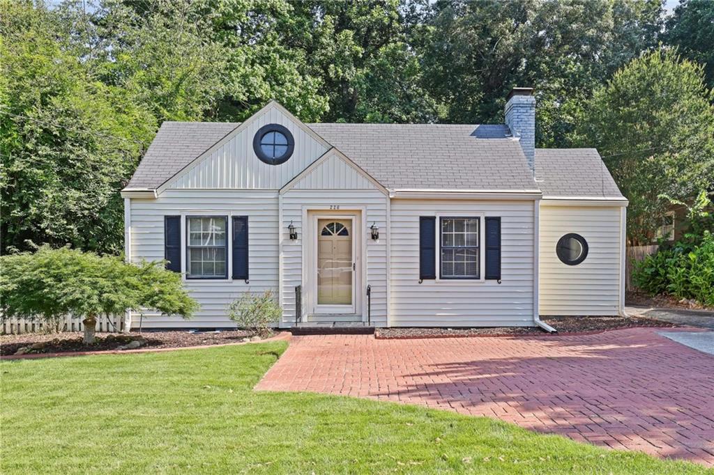 Adorable 1940's "Bell Bomber" bungalow on Historic Marietta's Polk St, conveniently situated directly across from Northcutt stadium and just a half mile from the vibrant Marietta Square and all it has to offer. This home features two full-sized bedrooms and one full bathroom, in addition to a smaller bedroom/office space. Upstairs is a finished loft area with a pitched ceiling and an attic space for storage. Living spaces include a living room with a fireplace and a separate dining room. The kitchen is located at the back of the house and includes the laundry. It opens to an outdoor deck and the backyard. A long driveway provides ample parking and leads to a separate one-car garage. The house sits on a deep lot that leaves plenty of space for expansion. This is a great opportunity to buy in a prime Marietta City location and customize the home to meet your needs!