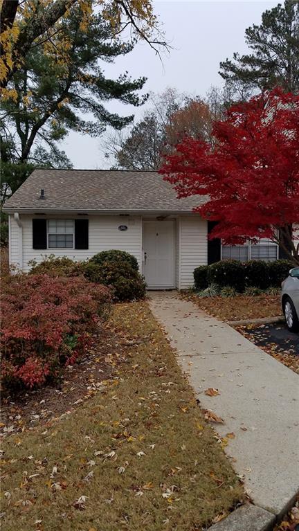 Experience the charm of this delightful ranch-style condominium, just minutes from the historic Marietta Square. The property features a beautifully updated bathroom, modern kitchen cabinets, a 2017 HVAC system, and brand-new tile flooring throughout. Nestled in a peaceful community, this cozy, well-maintained home offers amenities such as a clubhouse and a swimming pool. Enjoy the fantastic location, with Tumlin Park, dining, shopping, and restaurants all within walking distance.