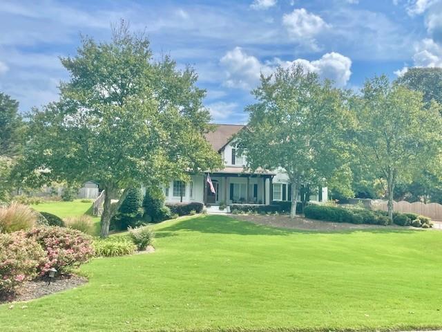 Check out this Beautifully remodeled home on a gorgeous professionally landscaped lot in Morgans Crossing, Buford. Hall County. This 5+ bedroom home boast of a Large Master on the main with trey ceilings, back door to a nice deck ready for morning coffee Large Master bath 2 shower heads double sink, nice walk in closet. On the main level you also have an Office with doors and a closet, if you needed an extra room on the main. Nice size Dining room, Vaulted Great room updated kitchen with slow close cabinets, drawers and Island. Walk in Pantry and Laundry room. An amazing screened in porch for enjoying the landscaped yard. Upstairs has another flex space, 4 additional bedrooms and a nice bathroom. The basement has A large living room, bedroom area, Kitchen and Full bathroom. Set up for a washer/ dryer as well. also 3 unfinished spaces for lots of storage. The home was updated 2023, Fresh paint inside and out. Sprinkler system for the landscape, This home is ready to move in