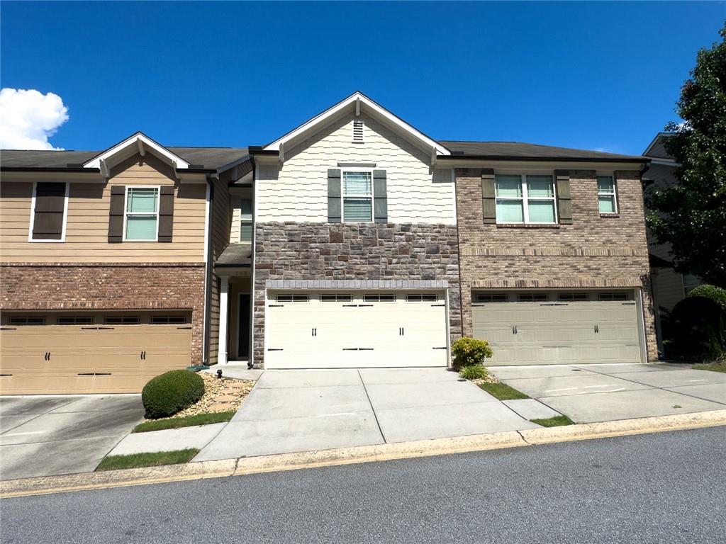 Spacious 3 Bedroom, 2.5 Bathroom Townhome in Prime Location! Welcome home to this beautiful and well-maintained 3-bedroom, 2.5-bathroom townhome, ideally situated between I-75 and I-575—just minutes from shopping, dining, and the vibrant energy of Downtown Woodstock. Step into an open-concept layout that’s perfect for entertaining, with a generous living and dining area that flows effortlessly into the kitchen. The kitchen features an updated backsplash, a gas range with broiler, and plenty of counter space and cabinetry to meet all your cooking needs. All appliances are included- refrigerator, microwave, washer, and dryer—so you can move in with ease. Upstairs, the oversized master suite offers a peaceful retreat with a spacious walk-in closet and a private en-suite bath. Two additional bedrooms share a full bathroom, along with a flex space that’s ideal for a home office, study area, or playroom. The convenient upstairs laundry makes everyday chores a breeze. Enjoy a comfortable lifestyle in a prime location, with all the modern features you’re looking for. Don’t miss out—schedule your showing today!