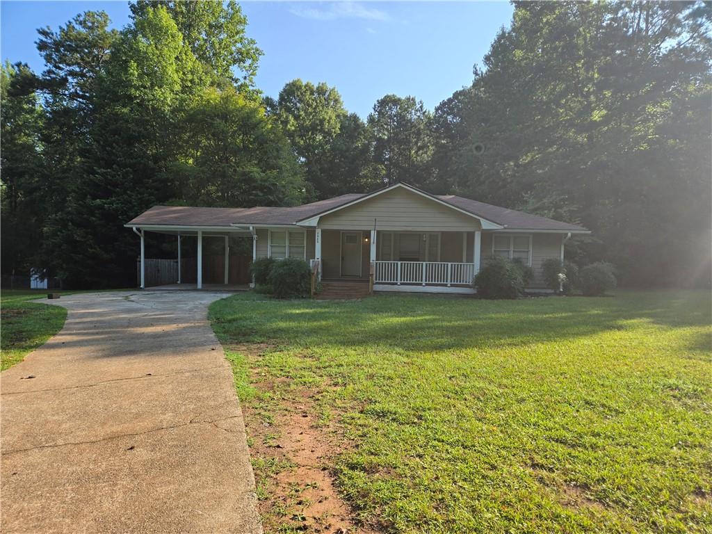 COUNTRY LIVING AT IT'S FINEST! Outside you will find a large 1-acre level lot with an enclosed back yard, huge "rocking chair" front porch and a deck. Inside this all-electric home there is NO CARPET, a delightful "soaking tub" and an OPEN CONCEPT to the common areas!