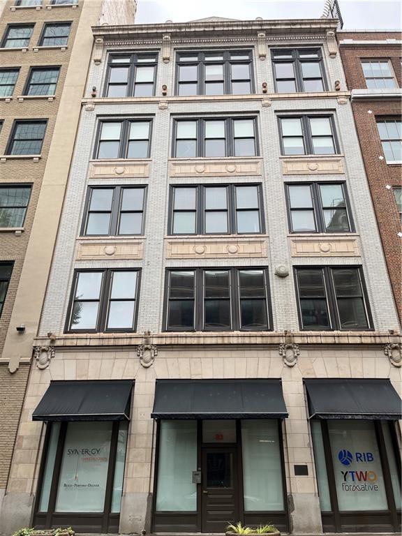 Historic 83 Walton Street is perfect for an office environment, medical, business, salon, etc... 83 Walton Street is a beautifully renovated row building constructed in 1916 in Downtown’s Fairlie-Poplar Historic District, whose buildings represent some of the city’s finest late Victorian and early 20th-century commercial buildings and the largest collection of such anywhere in Atlanta. 83 Walton Street was originally known as the The Massell Building and designed by architect Lodwick J. Hill, Jr. Listed on the National Register of Historic Places and once the home of Capricorn Records (the label that first represented Widespread Panic, The Allman Brothers Band, Cake, and Kenny Chesney), this building features high wood-beam ceilings and exposed brick. The surrounding streets feature some of the city’s best restaurants including White Oak, Alma Cucina, and Nikolai’s Roof, as well as major attractions like the College Football Hall of Fame, Georgia Aquarium, the National Center for Human and Civil Rights, and the World of Coke. The property is also situated next door to Georgia State University and within close proximity to Georgia Tech, both of which are top tier universities and produce some of the best workforce talent to be found.