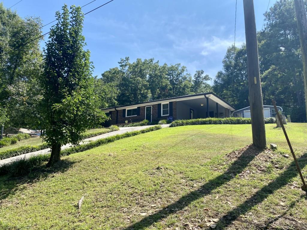 CHARMING BRICK RANCH ON QUIET DEAD-END STREET Don't miss this well maintained brick ranch- located just one mile from W.L. Swain Elementary School and a short drive to Calhoun, Rome and Adairsville. Set on a dead end street this home offers a quiet setting with mature trees and a large backyard- perfect for families, entertaining or simply enjoying the outdoors. Step outside to your own retreat, complete with a patio area, fire pit, above ground pool and spacious deck-ideal for relaxing or hosting guest. Inside, the home features original hardwood floors, blending timeless character with modern updates. Recent improvements include new vinyl windows, new counter tops and backspash, a new roof and gutters, HVAC system, and a new concrete walkway leading to the front door. Two oversized outbuildings- both with power- provide excellent space for storage, a workshop or hobby use. Whether you're a first-time buyer or looking to downsize, this home offers comfort, convenience and charm in a quiet, established neighborhood.