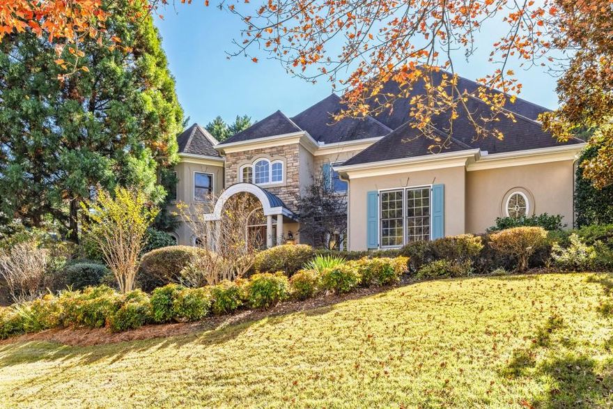 Nestled in the prestigious St. Lyonn neighborhood of East Cobb is an exquisite custom-built estate that exudes timeless elegance. Located within the top-rated Walton High School district, this home offers the best of refined living and convenience in one of Marietta's most sought-after communities.  From the moment you arrive, the stately curb appeal captivates. Inside, soaring ceilings, grand archways, and detailed millwork create an atmosphere of sophistication. The open floor plan is designed for both everyday living and entertaining, featuring multiple gathering spaces including a formal dining room, fireside living room, family room, and a richly paneled study.  The heart of the home is the kitchen, featuring custom cabinetry, a large island, and a sunlit breakfast area overlooking the private backyard. The spacious primary suite on the main level offers a peaceful retreat with a luxurious sitting area, a spa-inspired bath, a walk-in closet, and access to a serene terrace. Upstairs, generous secondary bedrooms each include en suite baths and walk-in closets.  The terrace level is an entertainer's haven with expansive floor space. Currently, there is a media room, game room, bedroom and bath, and an exercise room with an eight-person dry spa perfect for hosting guests or relaxing with family.  Step outside to a resort-style backyard featuring a sparkling pool and spa, along with multiple lounge areas surrounded by lush greenery for ultimate privacy. There's plenty of room to add an outdoor kitchen, making this space ideal for both entertaining and quiet enjoyment.  Every detail of this home reflects exceptional craftsmanship from the architectural features to the seamless indoor-outdoor flow. More than a residence, this property offers a lifestyle of comfort, luxury, and distinction in the heart of East Cobb. Enjoy low Cobb County taxes, great schools, and a short distance to Atlanta.