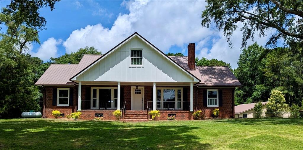 Welcome to your dream home on 4.93 acres of usable land—a rare find within the city limits of Columbus! This beautifully updated property blends the charm of a 1950s home with today’s most desired features. The exterior boasts new board and batten siding, fresh paint, and incredible curb appeal.
Step inside to a jaw-dropping open-concept floor-plan featuring designer accent walls, on-trend color palettes, and a gourmet kitchen complete with a luxury gas range. Throughout the home, you’ll love the brand-new wood flooring that adds warmth, style, and durability to every room. Custom plantation shutters allow natural light to fill the space while offering timeless elegance. The home offers 4 spacious bedrooms and 3 full bathrooms, including a main-level primary suite with a large walk-in closet and en-suite bath. A dedicated home office makes remote work effortless. Enjoy two large living areas, a stylish dining space, and a convenient laundry room that opens onto a MASSIVE screened-in patio—perfect for entertaining or relaxing while overlooking the fenced backyard.
But there’s more: A HUGE detached workshop with two car bays, full electrical, and plumbing for a future bathroom—ideal for hobbyists, mechanics, or creatives. A brand-new basketball court offers endless fun and fitness opportunities without leaving your backyard. This one-of-a-kind property checks every box for lifestyle, comfort, and space—all on nearly 5 acres of serene, private land. Schedule your tour today and experience this extraordinary home for yourself!