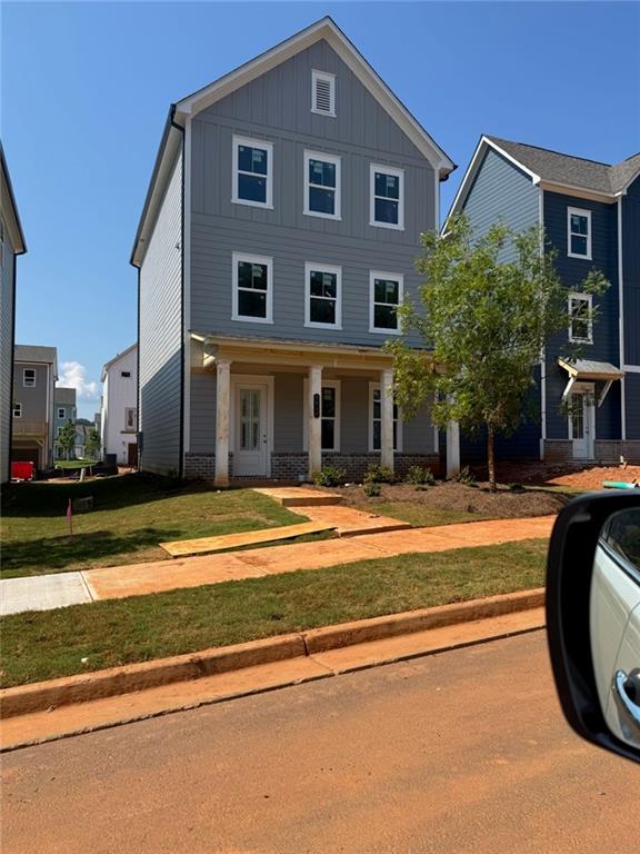 Be the first to lease this stunning, brand-new 4-bedroom, 3.5-bathroom home in the serene lakefront community of Madison at Buice Lake, just minutes from Downtown Woodstock, Target, Costco, Sam's Club, the Atlanta Outlet Shops. All appliances have WIFI enable controls! Washer/dryer included! The entry-level features a guest suite with a full bathroom. The main floor offers an open-concept layout with a spacious family room, dining area, and a modern kitchen equipped with an electric cooktop, built-in microwave, oven, and a brand-new refrigerator ideal for entertaining or relaxing at home. Upstairs, the expansive primary suite includes a walk-in closet and full bathroom, accompanied by two additional bedrooms, another full bathroom, and a convenient laundry area with an included washer and dryer. Enjoy outdoor living on the large deck, perfect for gatherings, and take advantage of the long driveway with ample parking for multiple vehicles. Residents also gain access to exceptional community amenities, including a clubhouse, pavilion, green spaces, walking trails, and pickleball courts, and swimming pools perfect for summer fun. WASHER AND DRYER INCLUDED