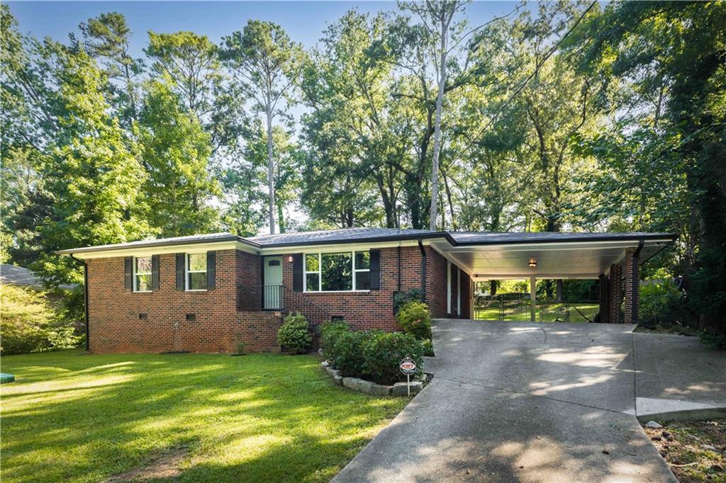 This beautifully renovated ranch just south of East Lake Golf Course blends classic charm with thoughtful, modern updates designed for everyday comfort and stylish entertaining. Inside, you’ll find an open-concept layout bathed in natural light that connects the kitchen, dining area, and screen porch—creating the perfect flow for dinner parties or casual get-togethers. The updated kitchen is an impeccable combination of style and function, with quartz countertops, marble backsplash, and a farmhouse sink. It also features smart appliances, including a Wi-Fi-enabled stove. Retreat to the oversized primary suite, where a spa-like bath awaits, complete with custom-built double vanities and HUGE double shower. Soak away the day in the luxurious 6-foot tub or get ready at your own pace in the spacious walk-in closet—complete with a separate vanity area and plenty of room for shoes and clothes for even the most stylish of homeowners. French doors provide direct access to the screened-in porch, not only bringing the outdoors in but also offering a peaceful place to start your mornings. Looking out over the large, private backyard offers endless potential for gardening, play, or creating your own outdoor oasis—even if you’re not a “yard person” yet. Whether you’re looking for a place to entertain, relax, or simply enjoy the perks of Decatur living, this move-in-ready gem has it all. Only a few blocks to East Lake Park, 2nd & Hosea, Oakhurst Village, Downtown Decatur, & more. Be fast or be last on this one!