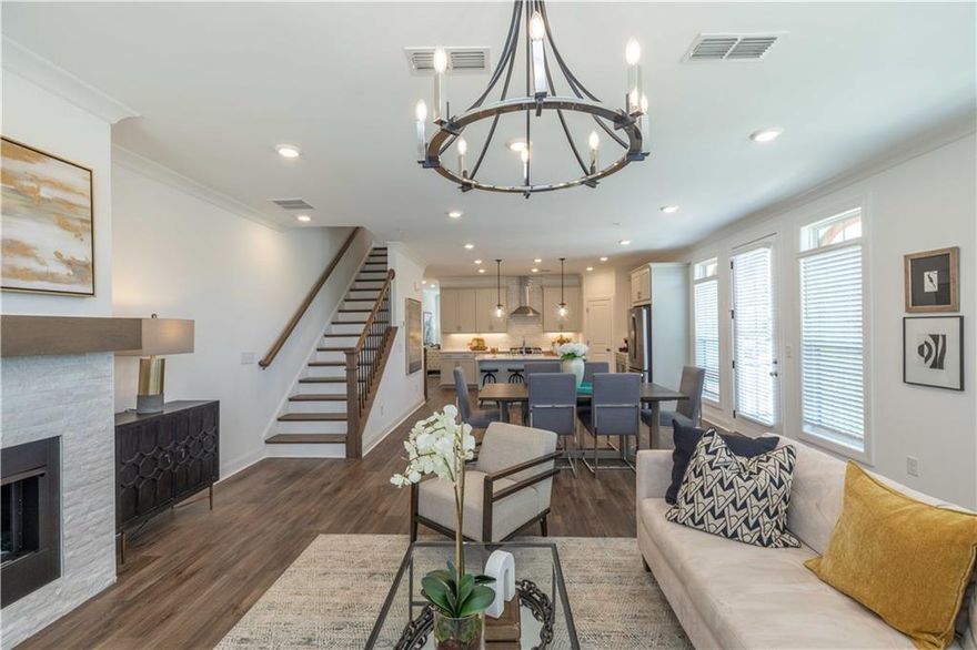 Spring into a New Home with The Providence Group! Experience elevated living in a beautifully designed townhome that blends modern elegance with everyday practicality. With 3 spacious bedrooms, 2.5 bathrooms, and high-end finishes throughout, this home is built for both comfort and style. From the moment you arrive, you’ll be welcomed by a private front entry, fenced-in yard, and a covered terrace—an inviting outdoor space perfect for relaxing or entertaining guests. Inside, the entry-level features a flexible office or media room with dual access via a front door and sliding glass door, offering a light-filled, adaptable space. On the main floor, the open-concept design creates a seamless flow between the living, dining, and kitchen areas. The centerpiece kitchen showcases a large island with Calacatta Sierra Quartz countertops, 42” cabinets with crown molding, and soft-close doors. Premium GE stainless steel appliances—including a gas range, built-in microwave, range hood, and dishwasher—complete the space. A private wooden deck extends your living space outdoors, perfect for unwinding or entertaining. Upstairs, retreat to the luxurious owner’s suite with a spa-inspired bathroom, alongside two secondary bedrooms with their own private deck. Unbeatable Location – Ideally situated just moments from Avalon, Downtown Alpharetta, and within walking distance to Top Golf and The Cooler. Dining, shopping, and daily essentials are all right at your fingertips. Home is under construction with a completion date of July/August 2025. Photos and Virtual Tour are of previously built Benton Plan. [The Benton I]
