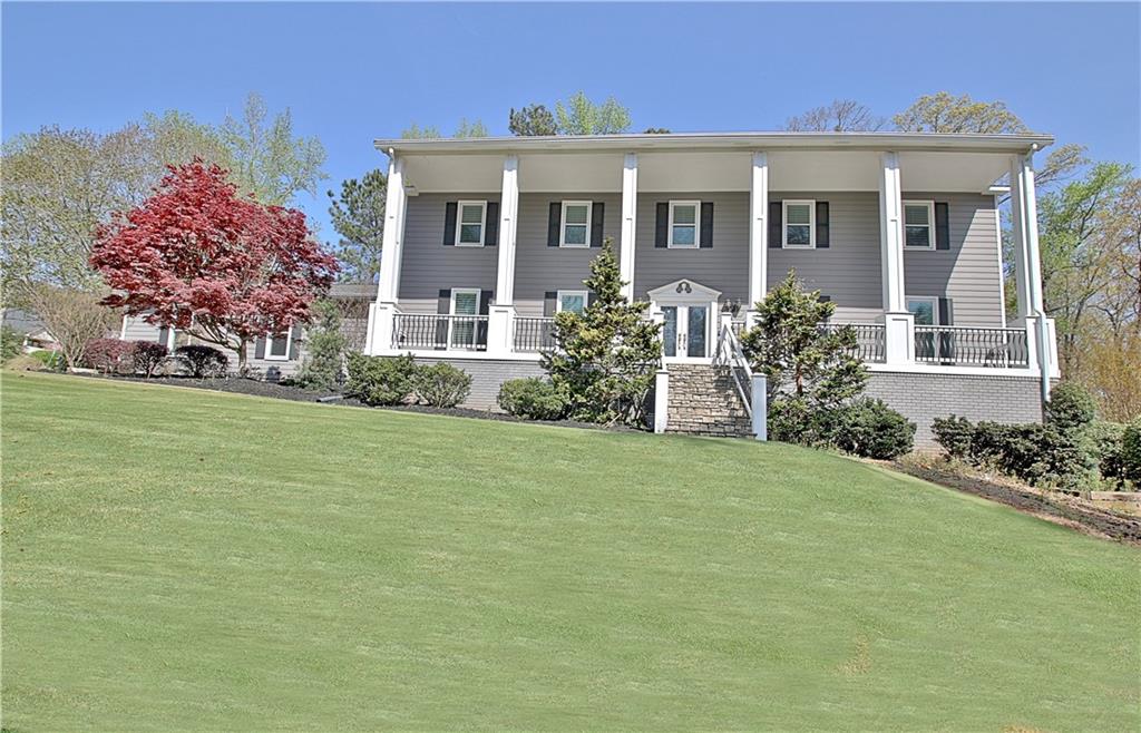 Buyer Incentive - New Granite or $25K Buyer Credit! Experience Southern Charm in Smokerise Plantation of Peachtree City, GA. Video Tour see https://youtu.be/7gvLbarnKrQ Seasonal Lake Kedron view from Rocking Chair Front Porch. Spacious w/ 5827 sq ft heated and cooled space! Beautiful and inviting 5-6 Bedrooms, 4 Full Baths, 2 Half Baths+ office on main or 2nd floor or Basement, Screened Porch, 3 car garage (one bay approx 32' deep) & Finished Daylight Terrace Level! Flex space upstairs for playroom, office, Retreat, media room or 6th BR. Lots of **upgrades and home improvements over $265K WOW** - Remodeled: Terrace level & added 1/2 Bath, added Hardi Plank siding to 3 sides of home, Front Porch, replaced windows w/Simonton 500 series Triple Pane Glass, deck and Screen porch remodeled/Fiber board decking, Anderson screen doors, PVC columns and trim and more. Smart home features: 60A ChargePoint EV charger, Rinnai tankless water heater, Ecobee thermostats, Ring doorbells and security system, Rachio smart irrigation system, Chamberlain my-Q garage opener, and CAT 5/6 cable run throughout the house to allow mesh network and multiple other WiFi-enabled devices (TVs, Alexa, gaming systems, etc). Protected with two whole home surge protectors hardwired inside each panel. Enjoy this gorgeous Re-landscaped yard with sprinkler system, Zoysia installed/tree removal, Plantation shutters, remodeled bathroom, Tankless H2O heater and more! Not only can this lovely home hold all your furniture and treasures it is located in the popular Estate neighborhood of Smokerise Plantation in north Peachtree City and sought after McIntosh HS district. The Guest Bedroom Suite / on the main could be In-Law suite or Home Office. All formal areas with Hardwood floors. Lg Dining Rm can hold extended seating for special occasions! Kitchen with Granite, Stainless Steel Appliances and Island/B-Bar opens to Breakfast area and Family Room. Laundry Rm on main is large with oversized storage closet and 1/2 Bath. Gather daily in the Family Room which is anchored with brick fireplace and flanked by built-in bookcases. Wall of glass doors bring the 1 acre of outdoors inside. Enjoy the renovated Screen Porch and deck with composite decking. Four secondary bedrooms will be the largest you can find. They share 2 full baths with one newly renovated! Relax in your Master BR Suite with private bath, dual vanity, lg tiled shower, jetted soaking tub and walk-in closet. One Room up could be Media/Owner Retreat area or Home Office. Recreation galore in full daylight terrace level. Home theatre room has bar area and kitchenette great for entertaining. adjoining areas include a game room , 1/2 bath, office or exercise room and tons of storage areas. The Zoysia lawn and lovely landscaping is stunning in the 1 acre yard. Take a golf cart ride from home on the 100+ miles of paved Golf Cart paths to Stores, Recreation, Top Ranked Schools, Country Clubs, Golf courses and lakes! Come enjoy Peachtree City an award winning Master Plan community Outside of Atlanta and the International airport. Closing is Flexible