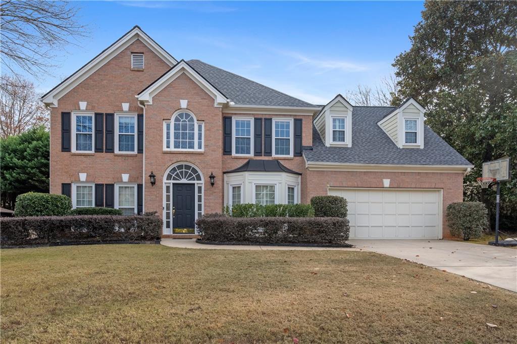 Nestled in a charming and serene neighborhood, in the desirable Windward subdivision. Windward is a prestigious, master-planned community situated in the heart of Alpharetta, Georgia. Known for its luxurious homes and exceptional amenities, Windward offers a vibrant and active lifestyle. This beautifully 2 stories well maintained home offers a perfect blend of comfort and style. With 5 bedrooms and 2.5 bathrooms, this residence is ideal for both relaxing and entertaining. Additional bedrooms are well-sized and perfect for family or guests. It boasts brick front with hardie Plank siding, new roof, water heater. Updated kitchen includes granite counters, tile backsplash, island, Stainless steel appliances, newer lighting, pantry, mom's work desk, hardwood floors, breakfast area and view to fireside family room. There is a bonus tool Room in the garage. Master bedroom features tray ceiling, sitting area, master bath w/jetted tub, separate shower, his/her vanities. Additional bedrooms are well-sized and perfect for family or guests. Step outside to the beautifully fenced landscaped backyard, perfect for outdoor entertaining or simply unwinding after a long day. This home is conveniently close to top tier schools, approximately 2 miles from halcyon, 5 miles from Avalon, and 6 miles from downtown Alpharetta where you can enjoy shop at unique boutiques and specialty stores, enjoy live music or experiment dining at its best. Don't miss the opportunity to make this house your new home!