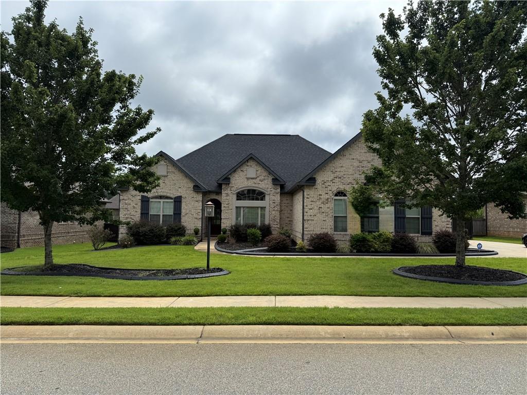 Welcome to 823 Kyler Ln, a stunning four-sided brick home located in the desirable McCarley Downs Subdivision. Built with quality and style in mind, this residence offers an exceptional blend of luxury and functionality—all just minutes from Robins AFB.
Step into a spacious foyer with gleaming hardwood floors that flow into the expansive great room, complete with a cozy electric fireplace and soaring ceilings. The custom kitchen is a showstopper, featuring granite countertops, an oversized island with breakfast bar, stainless steel appliances and designer cabinetry—perfect for everyday living and entertaining.
Enjoy formal meals in the elegant dining room with coffered ceilings or casual breakfasts in the sunlit dining area. The split-bedroom layout provides privacy and comfort, with the luxurious owner’s suite offering a retreat-like feel—complete with tray ceilings, a spa-style bath with double vanities, a jetted soaking tub, separate tiled shower, and a large walk-in closet.
Additional bedrooms are generously sized, including one with its own full bath, ideal for guests or a private in-law suite. Step outside to the screened-in covered patio and fenced backyard—an ideal space for outdoor dining, morning coffee, or relaxing evenings.
Other features include a side-entry garage, smart home technology, and energy-efficient construction. Conveniently located near top-rated schools, shopping, dining, and RAFB—this move-in ready home checks every box!
