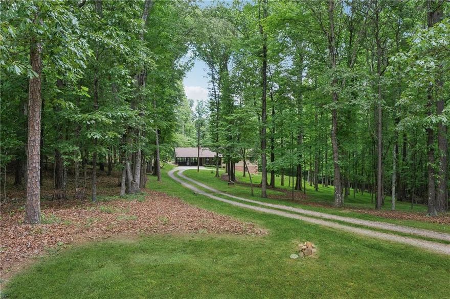 Discover 7.26 picturesque acres just minutes from the expansive 137-acre Milton City Park & Preserve—offering scenic trails, a community pool, tennis center, and more. This rare property features a charming 1,400 sq ft ranch-style home built in 1980, with 3 bedrooms, 2 full baths, an open-concept kitchen and family room, and a spacious sunroom equipped with its own split HVAC system for year-round comfort.
Endless potential awaits—renovate or expand the existing home to create your own private estate, or take advantage of the generous acreage to design pastures, a riding arena, and a barn for equestrian living. Alternatively, the land offers potential for subdivision into 2+ acre lots for custom dream homes.
Currently serviced by a well, the property also has access to county water at the road. Enjoy convenient proximity to parks, acclaimed restaurants, boutique shopping, and the vibrant downtown Alpharetta. Families will appreciate access to top-rated schools including Birmingham Falls Elementary, Hopewell Middle, Cambridge High School, and nearby King’s Ridge Christian School.
Don't miss this unique chance to own a slice of Milton’s most desirable landscape!