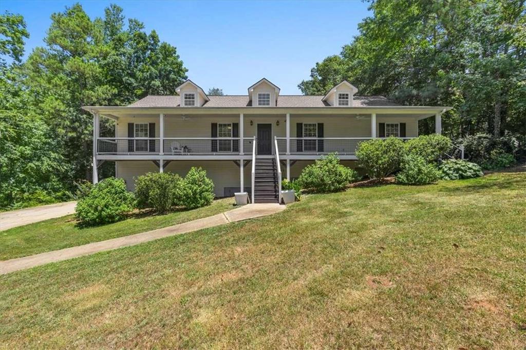 A rare and welcome opportunity to buy a home that can become an income producing property as well as a charming home. The main level has 4 bedrooms and 3 bathrooms while the lower level has 2 additional bedrooms and full bath! A home within a home!    This handsomely updated home sits on 2 Acres! Featuring Open Floor Plan with 6 Bedrooms/4 Baths, Finished Basement with Bedroom/Full Bath, Extra Space in Basement for Storage, Well Maintained Hardwoods, Separate Dining Room, Large Family Room with Trey Ceilings, Large Master Bedroom/Bath. Large back yard with a back deck for entertaining, not in a Subdivision, No HOA, Newer Roof 2019, New Paint, & Newly stained porches! Home has transferable CHOICE HOME WARRANTY. Call today for your Showing!
