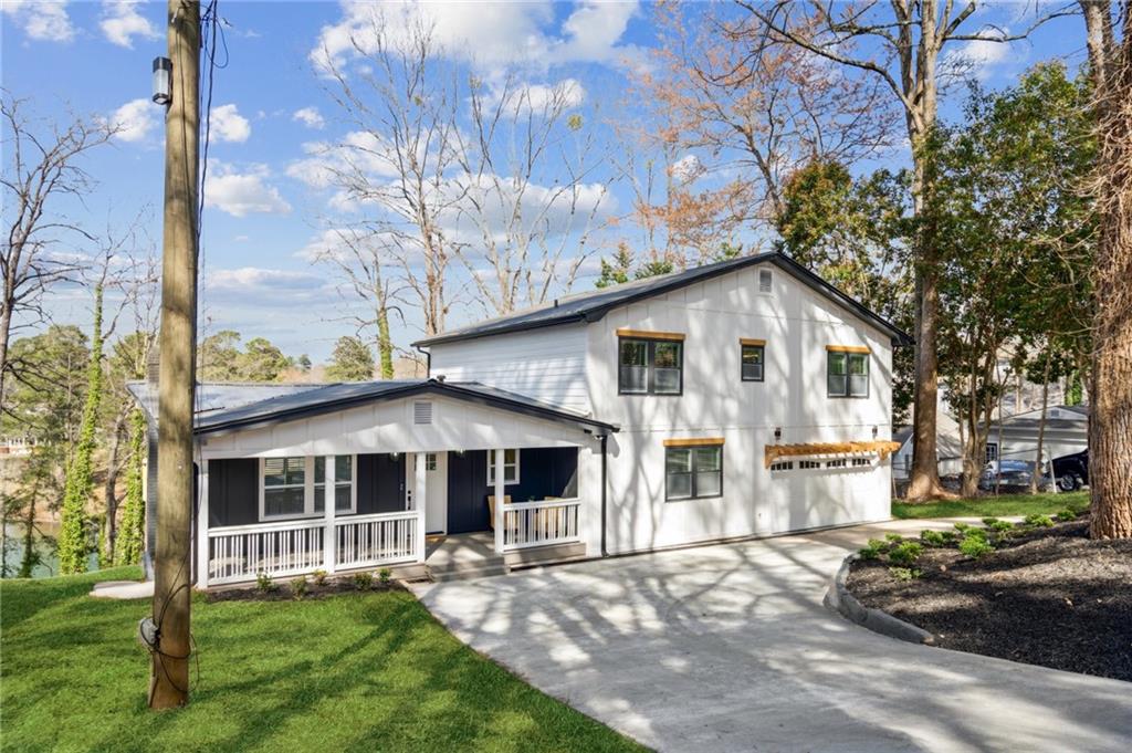 *A CERTIFIED 5 STAR HOME! $10,000 towards Buyer's Closing Costs, 2-10 Home Warranty included, Termite Warranty included, Septic Tank inspection completed.* Experience lakeside luxury at its finest with this newly remodeled custom-built masterpiece nestled in a quiet cove on beautiful Lake Lanier. .33 Acre Lake Lot in prime NE Forsyth County located on Young Deer Creek. Amazing lake home FULLY RENOVATED and inspected by Forsyth county with just about everything brand new! NEW ROOF with ARCHITECTURAL SHINGLES, New Siding, Multiple new decks, New Kitchen & appliances, All New Bathrooms, New flooring throughout, New HVAC & ductwork, New windows, doors, plumbing & 90% New wiring! 2 Laundry Rooms. 50amp service in garage for EV & hot tub. The terrace level is perfect for additional entertainment complete with half bath, rec room, den, exit to backyard & Lake, and 2nd laundry room. NO HOA!! Private covered lighted 32x20 Dock on Lake Lanier. East Forsyth High School district. #HeadEast Move in ready & ready for immediate occupancy. Your lake life is calling!