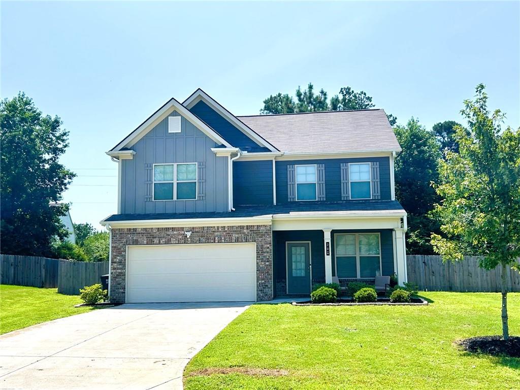 This is the greatest home value and lowest price in the nearly completed Henderson Glenn neighborhood! It's tucked away from traffic, yet in the award winning Calhoun City School district. Whether you're entertaining your adult friends, or your children are entertaining their friends, this nicely finished home has plenty of open floor space and high ceilings. The lot is level with a large, fenced back lawn and covered patio. The greater spacing between this home and the neighbor's is also what sets it apart from the other homes. The home is across from the sidewalk that leads to a walking trail. Don't miss seeing this beautiful home.