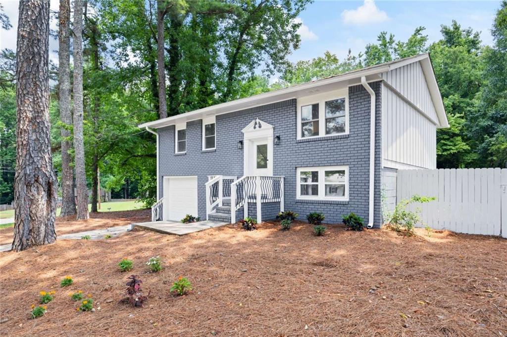 Fully renovated 4 bedroom, 3 bathroom West Cobb home on quite cul-de-sac . This home is FULLY UPGRADED AND MOVE IN READY with new windows, interior and exterior paint, beautiful large fenced in backyard with pergola awning over the back patio, new HVAC system, water heater, and engineered maple wood flooring. You will enjoy cooking and entertaining in the open concept living room and gorgeous new kitchen cabinets, quartz countertop, tiled backsplash, appliances, large kitchen sink, and faucet. All bathrooms feature new gorgeous new tile, vanities, and fixtures. The home features new light fixtures throughout, a gorgeous floor to ceiling electric fireplace in the large recreation room, spacious laundry room, and 1 car garage. You won’t find another home like this one!