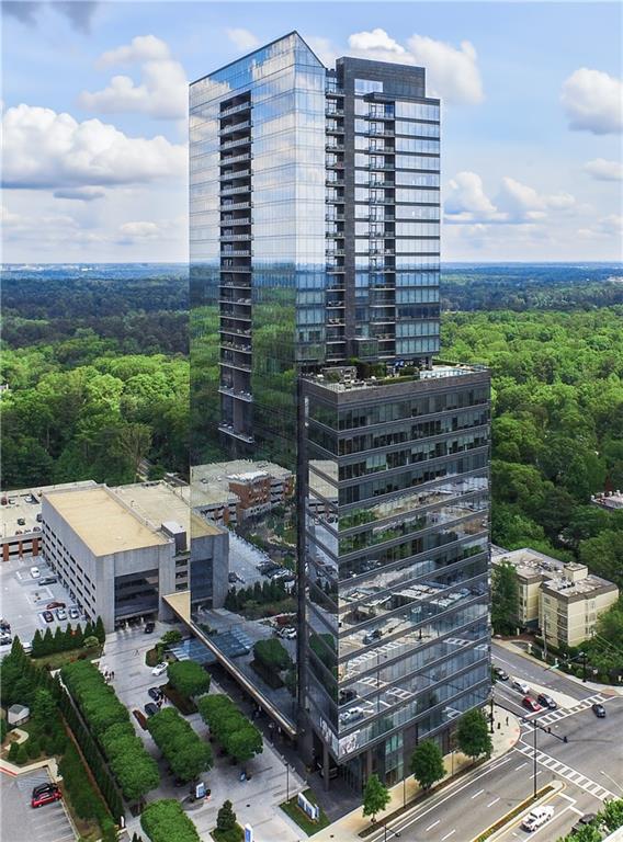 Sophisticated Buckhead Penthouse with Unrivaled Privacy, Views, and Entertaining Spaces. Experience a haven of opulence where the legendary Ritz-Carlton service defines your daily life. This extraordinary residence showcases the masterful interior design of Robert Brown, one of Atlanta's most celebrated designers whose sophisticated aesthetic and timeless vision have earned him Veranda magazine's Southeastern Designer of the Year and over twenty American Society of Interior Designers (ASID) awards. From attentive concierge assistance to in-residence dining and a dedicated residential management team, every detail is curated to ensure unparalleled privacy, comfort, and convenience.  Step into a world of timeless luxury perched on the prestigious 34th floor. This exclusive penthouse-one of only two residences on the top level-offers a sanctuary above the city. With 3 bedrooms, an office, and 3.5 bathrooms, this elevated retreat redefines elegance and sophistication. Expansive, unobstructed 270-degree panoramic views capture Atlanta's diverse beauty, including sweeping vistas of the Perimeter Area, Brookhaven, Buckhead, Midtown and Downtown Skylines, Stone Mountain, and iconic landmarks like Kennesaw Mountain. Each sunset casts a masterpiece of color across your windows, drawing you into a moment of awe and reflection at the breathtaking spectacle.  The primary suite is a serene sanctuary, complete with a private seating area and elegant fireplace. Enveloped in tranquility, the spa-like ensuite bathroom boasts heated marble floors and luxurious finishes. Dual vanity areas and two expansive walk-in closets create an indulgent, personal retreat that whispers comfort and sophistication. Each additional bedroom is designed as a private oasis, offering en-suite bathrooms with exquisite marble finishes. Every corner of this home radiates with warmth and refined detail, providing unparalleled comfort for family and guests. A private office with rich wood-paneled walls offers an inspiring workspace framed by stunning skyline views.  Feel the luxury of seamlessly connecting to your home through a premier Savant home automation, allowing effortless control of blinds, drapes, lighting, thermostats, and entertainment systems. At the touch of a button, transform the atmosphere to match your mood, whether it's a cozy evening in or a vibrant gathering of friends.  Designed with entertaining in mind, the residence boasts an expansive gathering space. A stylish bar with a large wine fridge complements the floor-to-ceiling windows, which frame spectacular views. Two private balconies provide the perfect escape to enjoy a morning coffee or unwind with a glass of wine beneath the stars. The open-concept living area harmoniously blends a welcoming living room with a fireplace and a chef's kitchen outfitted with top-tier Viking appliances. Every detail elevates your hosting experience-a celebration of taste, style, and connection.  Further amenities include: o A resort-style pool, updated fitness center, massage room, and outdoor grilling and gathering areas for unparalleled relaxation. o Two private guest suites for visitors, ensuring their stay is as luxurious as yours. o Four secure parking spaces with valet service and two private, climate-controlled storage rooms for added convenience.  Situated in the heart of Buckhead, this penthouse offers unmatched proximity to fine dining, luxury retail, and Atlanta's most coveted attractions. More than just a residence, this home is a testament to the art of living well. From the award-winning design sensibilities of Robert Brown to the legendary Ritz-Carlton service, every moment in this extraordinary space feels like a masterpiece of urban luxury.  Discover the life you deserve. Let this penthouse redefine what home means to you-where breathtaking beauty, unrivaled privacy, and world-class service converge into an experience that transcends the ordinary.