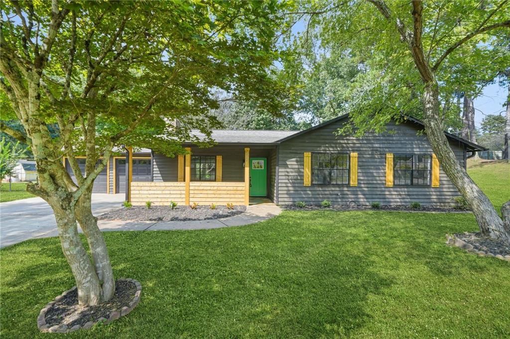Welcome to 620 Blue Flag Lane in Fairburn!
This beautifully renovated 3-bedroom, 2-bath home offers 1,404 sq ft of stylish, modern living. Inside, you’ll find an inviting open layout anchored by a cozy fireplace with custom built-in bookshelves, creating the perfect spot for relaxing or entertaining. The fully updated kitchen features sleek finishes and ample storage, while both bathrooms have been thoughtfully refreshed with modern touches.
The home’s single-level design makes everyday living easy, with spacious bedrooms, natural light throughout, and move-in ready updates from top to bottom. Outside, enjoy a private backyard ready for gatherings, gardening, or quiet evenings.
Conveniently located near shopping, dining, schools, and quick access to major highways, this Fairburn gem combines comfort, style, and location in one.
Schedule your showing today—this one won’t last!