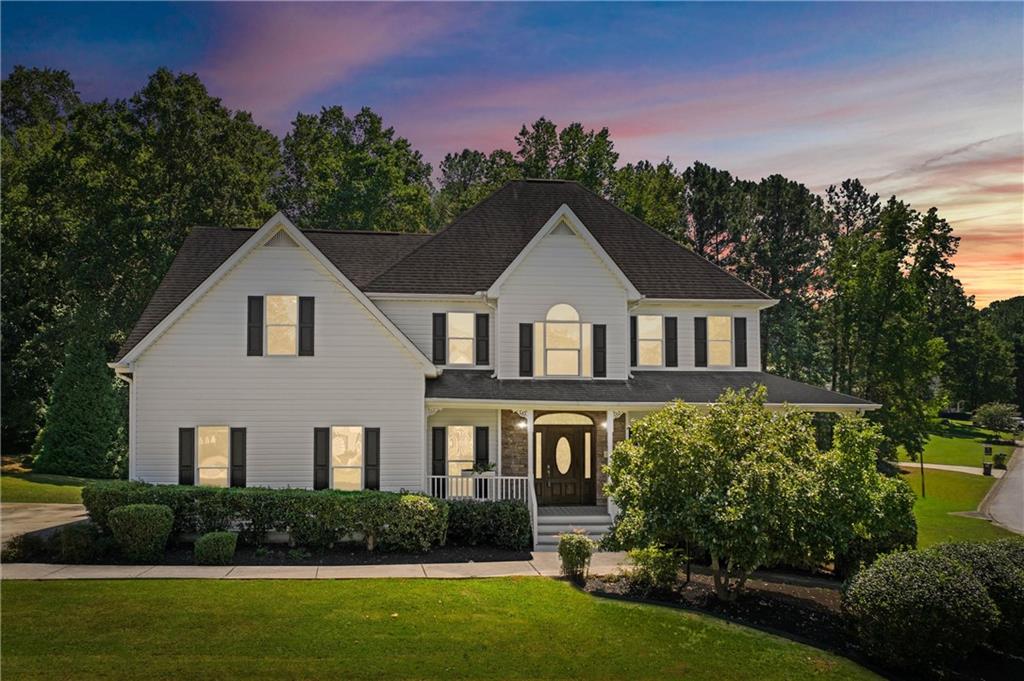Totally Renovated Traditional Home in The Heritage Subdivision! This stunning 5-bedroom, 3.5-bath residence has been completely updated with modern finishes while preserving its timeless charm. The inviting floor plan showcases high ceilings, a two-story foyer, and a spacious master suite on the main level with a tray ceiling, double vanity, granite counters, separate shower, and a luxurious soaking tub. The gourmet kitchen is designed for both function and style with granite countertops, a center island, pantry, and breakfast area, and comes equipped with stainless steel appliances, including a dishwasher, microwave, and gas oven/range combo. Fresh LVP flooring runs throughout the home, complemented by all-new bathrooms and thoughtful upgrades. The fully finished basement expands your living options with a large recreation room, an additional bedroom, and a full bath—making it ideal for an in-law or teen suite. Outside, a screened-in porch provides the perfect retreat for relaxing or entertaining, overlooking the private backyard. Additional highlights include a new water heater and a two-story outbuilding that would make an excellent workshop or provide plenty of extra storage. This move-in-ready home is located in the sought-after Heritage subdivision of Paulding County and offers both modern comfort and timeless appeal.