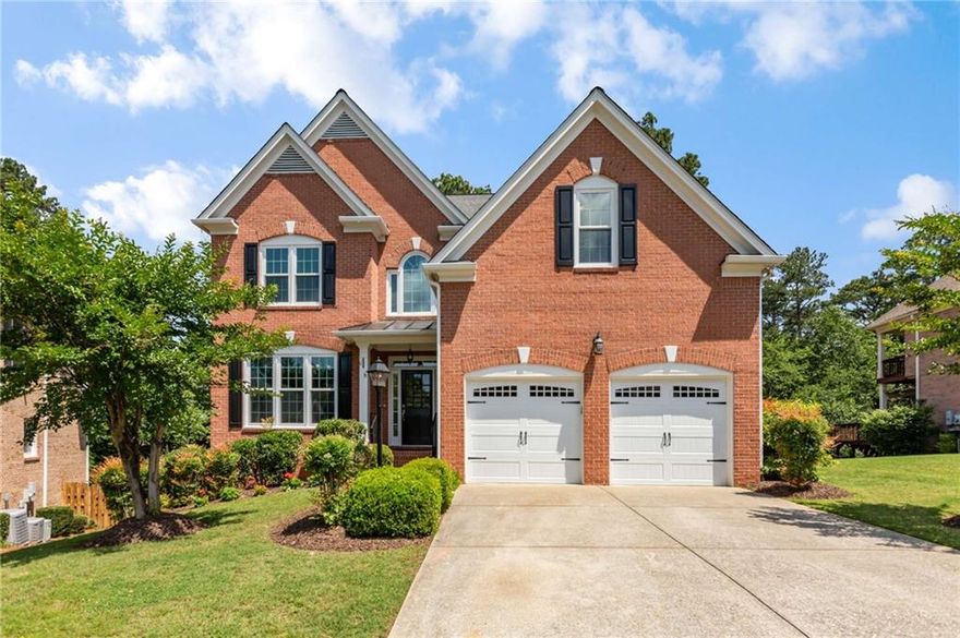 Welcome to 210 Wentworth Terrace, where every corner of this home is made for making memories. Tucked at the end of a quiet cul-de-sac in Johns Creek, this all-brick beauty offers the perfect mix of fun, function, and classic charm. Mornings begin with sunlight pouring into the vaulted living room as you grab breakfast in the cozy kitchen nook before heading off to work or to school in one of the area’s top-rated districts. After a busy day, everyone gathers in the heart of the home—whether that’s cooking together in the spacious kitchen, relaxing in the sunroom with board games, or cozying up by the fireplace. The main-level primary suite gives you your own quiet space, while upstairs bedrooms are perfect for kids or guests, office space - you name it! The custom shelving in the huge closets makes storage out of sight, out of mind. The hardwood floors have just been refinished and are spectacular! 

Downstairs, the finished basement becomes the ultimate hangout spot. There’s room for movie nights, a pool room, a custom bar area that is excellent for maximizing entertaining with your friends and there is even a built-in electric sauna with steam—yes, it's for serious relaxing - you'll love it before or after a dip in the hot tub!  On weekends, step outside to a backyard built for play and relaxation, from the hot tub on the terrace level to grilling and dining al fresco on the expansive multi-level decks. Sundowner's cocktail hour is the best here! Host birthday parties, BBQs, enjoy backyard games, or just soak in the peace and privacy of your new tree lined private and fenced back yard.

You’re minutes from shopping & restaurants & fun at Avalon, Wills Park, Rock Mill Park, Downtown Alpharetta & Johns Creek attractions like the Ameris Amphitheatre, Top Golf, Country Club of Roswell and so much more! With easy access to GA-400, getting to work or weekend adventures is a breeze. This home is more than a place to live—it’s where your next chapter begins!