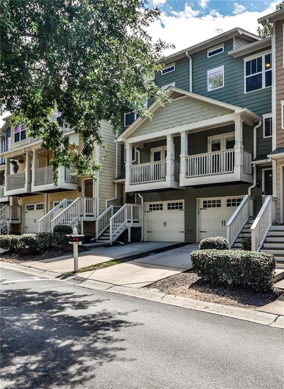 Located in the gated Liberty Park community on Atlanta’s vibrant Upper Westside, 1208 Liberty Parkway NW offers the perfect blend of modern convenience, thoughtful design, and secure, community-focused living. This three-story townhome features an open, light-filled layout with hardwood floors throughout the main level, seamlessly connecting the living room, dining area, and kitchen. The kitchen is well-appointed with granite countertops, white cabinetry, stainless steel appliances, and a breakfast bar ideal for casual dining or entertaining. A conveniently located half bath on the main level enhances everyday functionality. Enjoy two private outdoor spaces - a front balcony off the living room and a rear deck off the dining area - perfect for morning coffee, evening relaxation, or hosting guests. Upstairs, two generously sized bedrooms – each with vaulted ceilings - serve as dual primary suites, both featuring en-suite bathrooms and walk-in closets. A hallway laundry room, situated between the two bedrooms, adds additional convenience. The lower level offers a versatile third bedroom or bonus space with a half bath, ideal for a home office, guest suite, or fitness area. Additional highlights include a one-car garage, driveway parking, and ample storage throughout the home. Liberty Park residents enjoy 24-hour gated security, a community pool, and a dog park. The location offers quick access to Westside hotspots such as The Works, Westside Village, and numerous restaurants, parks, and retail. Midtown, Downtown, and major highways are all just minutes away, making commuting a breeze. Move-in ready, this home delivers comfort, style, and convenience in the best of Atlanta’s Upper Westside lifestyle.