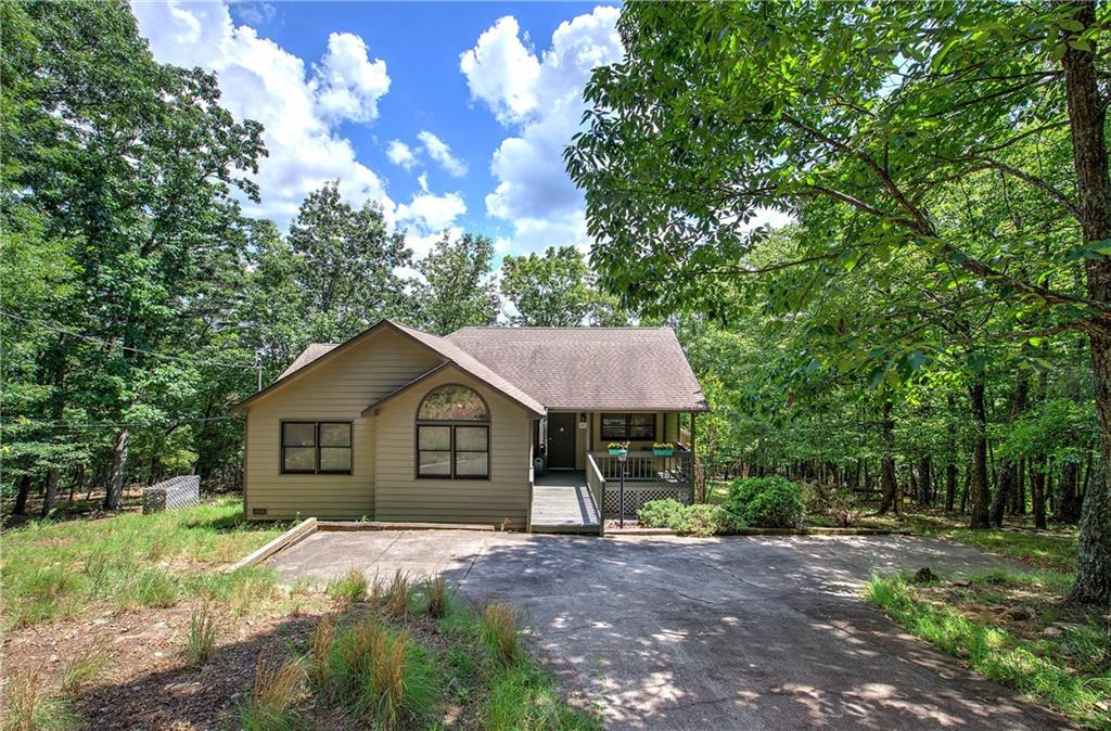 Step into this inviting ranch-style home, filled with natural light and a bright, open floor plan that makes the most of its space. Featuring three comfortable bedrooms and two full baths, this home offers an efficient layout that feels both cozy and spacious. The kitchen is thoughtfully laid out for ease and functionality, flowing seamlessly into the main living area. Step outside to enjoy a private back deck perfect for grilling or soaking in the view and a screened porch where you can relax and unwind, rain or shine. With long-range views and a sense of privacy, this home is an ideal retreat for peaceful, everyday living. Home is being sold fully furnished. There is plenty of room on the lot to add a garage if desired. Bent Tree encompasses 3500 acres and features 24/7 security, a 110-Acre private, stocked lake perfect for fishing and kayaking, an 18-Hole Joe Lee designed golf course, tennis and pickleball courts (both inside and outside), two pools, a beach area, hiking trails, water falls, its own fire department and water system, a dog park, bocce ball court, basketball court, horseshoe court, playground, boat storage, boat launch area, clubhouse, restaurant, waterfalls and hiking trails.