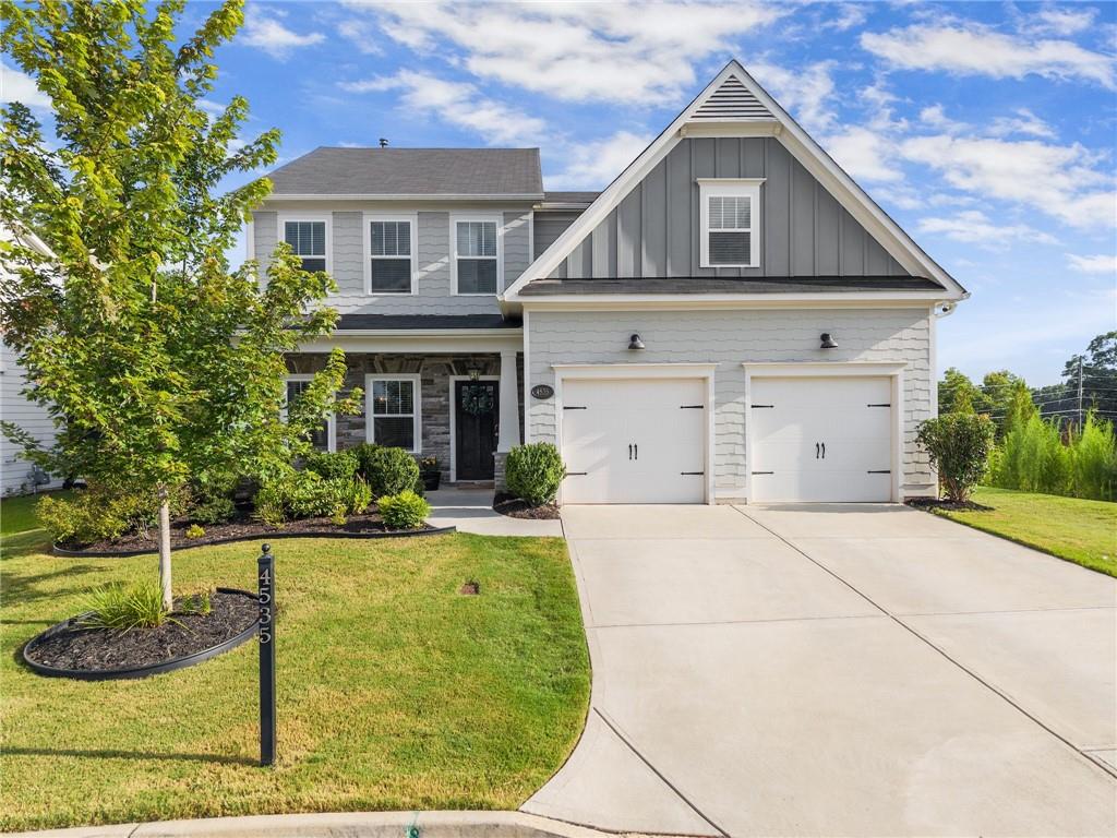 Welcome to your dream home in the highly sought-after Lake Haven community in North Forsyth County! Built in 2020, this stunning 5 bedroom, 4 bath home sits on a quiet cul-de-sac lot and is less than a mile from the brand-new Sawnee Mountain Park. Step inside to discover a spacious open-concept layout featuring an eat-in kitchen with granite countertops, gas range, breakfast bar, and a separate formal dining room perfect for entertaining. A bedroom and full bath on the main level offer convenience and flexibility, while the living room boasts a gorgeous stone fireplace creating a cozy, inviting atmosphere. Upstairs, you’ll find an oversized master retreat complete with two walk-in closets, a spa-like bathroom with dual vanities, separate tub and shower, and a private laundry room. Three additional upstairs bedrooms all feature walk-in closets, including one with its own ensuite bath, plus a hall bath for added comfort. Outside, the backyard is a true oasis - fully fenced and packed with upgrades: professionally leveled and elevated, complete with pavers, lush landscaping, new grass, French drains, a covered patio, and a gas line ready for your grill or outdoor kitchen. Enjoy resort-style neighborhood amenities including a clubhouse, Olympic lap pool with kiddie pool, tennis & pickleball courts, playground, green space, and private lake access with a dock and hiking trails. This home offers the perfect blend of luxury, function, and lifestyle in one of Forsyth’s premier communities. Don’t miss your chance to call it home!