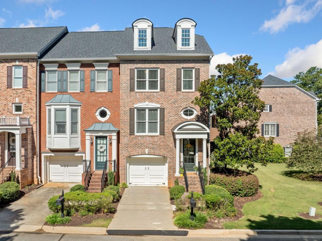 Don't miss this Seller Incentive: 1 year paid at closing HOA Dues!!! Welcome to this beautifully maintained 2-bedroom, 2.5-bath end-unit townhome with a versatile bonus room, located in the highly desirable gated community of Heritage at Roswell. This spacious home offers a seamless flow between the living, dining, and kitchen areas perfect for entertaining or everyday living. Step out onto the private deck to enjoy your morning coffee or evening unwind in peace. Upstairs, retreat to the expansive primary suite featuring an oversized walk-in closet and a luxurious primary bath with a soaking tub, separate shower, and double vanity. Down the hall is another spacious secondary bedroom with a full bath. Downstairs the bonus room adds great flexibility perfect for a gym, home office, guest bedroom, or media room. It has exterior entry with under deck coverage and patio space. Enjoy resort-style living with top-notch community amenities, including swimming pools, tennis and pickleball courts, clubhouse, fitness center, and beautifully maintained green spaces. Nestled just off Hwy 92 with convenient access to GA-400, you're only minutes from Roswell Park, vibrant Canton Street dining, boutique shopping, and more. Don't miss your opportunity to live in one of Roswell's most sought-after communities!