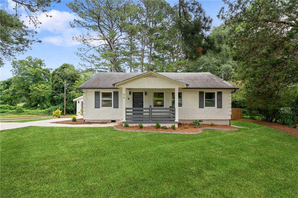 This completely move-in-ready home recently underwent a full renovation and is located in a sought-after location just around the corner from adorable downtown Fairburn and two blocks from Landmark School! Situated on a beautiful corner lot, this home boasts upgraded electrical and plumbing systems as well as newer HVAC, water heater, and roof. Inside, the finishes are everything you are looking for -- From the white kitchen cabinets, black pearl leathered granite counter tops, and full suite of stainless steel appliances to the luxury vinyl flooring throughout, the touch screen vanity mirror + new flooring, doors, windows, and shades, this home truly has it all! You'll love the modern conveniences like the bluetooth garage door opener and the bidet with a heated seat. The home has charm, character, and all the modern updates and finishes you are searching for in your new home! Newly poured concrete driveway with additional parking pad/turnaround area is another huge expense that wasn't spared on this amazing opportunity to own in the best location in Fairburn. The large, fully-fenced backyard features a beautiful deck perfect for entertaining and enjoying the outdoors. Have a dog? They will love the backyard!! Don't have a dog? This yard is begging you to get one! In addition to being just minutes to shopping, dining, and retail, you can get to Hartsfield-Jackson International Airport in about 13 minutes!! The proximity to sporting events and concert venues in downtown Atlanta will be the cherry on top for this great location! This home is the most turn-key property at this value for the area to be this close to downtown Fairburn and Landmark School, so don't let this opportunity pass you by, and schedule your showing today!