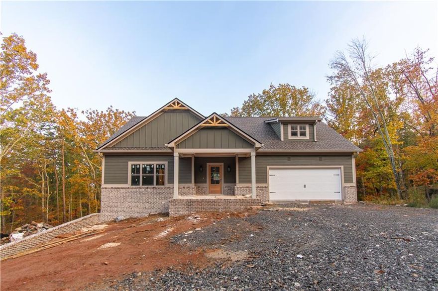 Amazing New Construction Home!

Welcome to this stunning 4-bedroom, 3-bathroom new construction home featuring an open, stylish design and a full unfinished basement ready for your personal touch.

The chef-inspired kitchen boasts solid wood cabinetry with soft-close doors, leather-finished granite countertops, a spacious center island, stainless steel appliances, and a large walk-in pantry with custom shelving and a frosted glass door.

The primary suite offers a touch of luxury with a tongue-and-groove coffered ceiling, a custom wood-shelved walk-in closet, and primary bath featuring a double vanity, large tiled shower, and private water closet.

Beautiful LVP flooring flows through the main living areas, while the upstairs bedrooms feature cozy carpeting. The inviting living room centers around a brick fireplace with a solid wood mantle, complemented by crown molding, stained barn doors to the laundry room, ceiling fans in both the living room and primary bedroom, and a tankless water heater for energy efficiency.

The home’s exterior combines elegance and charm with a brick front skirt, Board and Batten accents, a covered back porch and deck, and a welcoming front porch—perfect for relaxing or entertaining.

This thoughtfully designed, open-concept home truly has it all. Schedule your private showing today—this one won’t disappoint!