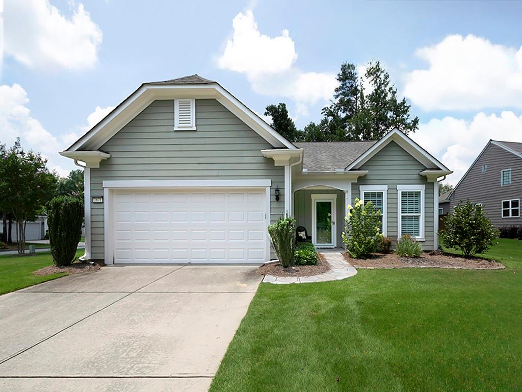 Welcome home to this single level, primary on main three bedroom, two bath home with two car garage nestled on a desirable corner lot in beautifully landscaped, well maintained Woodrush neighborhood. Highlights include substantial crown molding in most rooms, built in mud room bench, wainscoting, seamless hardwood floors, plantation shutters in all rooms, a large open kitchen with huge island and lots of storage, an 8-10 seat dining area, walk in laundry room and closets galore. The inviting fireside family room is perfect for entertaining or cozy nights in and opens to a relaxing screened in porch overlooking a private fenced in yard. The sun-filled living room/sitting room is a great flex space. The spacious primary suite features a tray ceiling and luxurious bath with large walk in closet. The split bedroom floor plan offers ideal privacy for family or guests. Located less than 1 mile from shopping, dining and more. Low maintenance living-HOA includes exquisitely manicured landscape maintenance and trash/recycling service.Neighborhood offers a walking trail. Don't miss this rare opportunity to call this sought after neighborhood HOME!