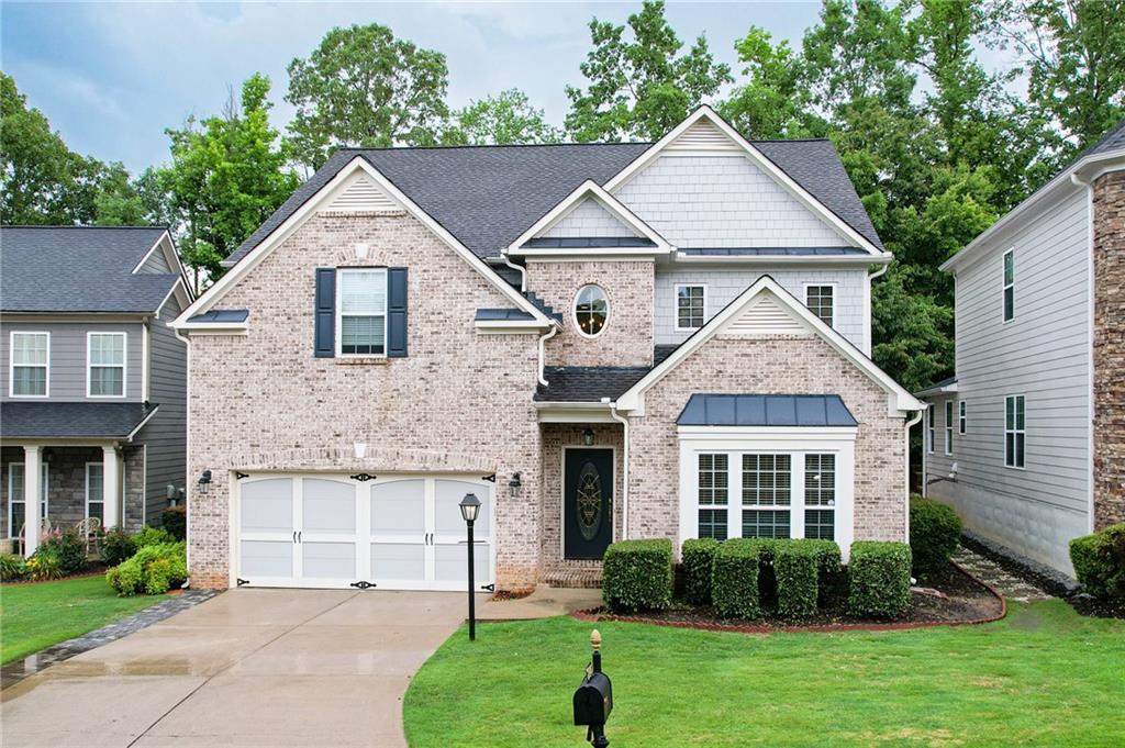 Prime Location in Sought-After Lambert High School District! Welcome to this beautifully maintained home nestled in one of Forsyth County’s most desirable neighborhoods! Located just minutes from The Collection at Forsyth, Sharon Springs Park, Emory Johns Creek Hospital, and Northside Hospital, this home offers both convenience and top-rated schools, including the prestigious Lambert High. Step inside to recently installed Luxury Vinyl Plank flooring throughout the main level, enhancing both style and durability. A versatile flex space at the front of the home is perfect for a home office, playroom, or additional sitting area. The open-concept floorplan offers a seamless flow from the flex room to the formal dining room, spacious kitchen, and cozy family room. The chef’s kitchen is a dream—featuring granite countertops, stainless steel appliances, and a huge center island overlooking the family room, ideal for entertaining. A large formal dining room and oversized laundry room complete the main level. Upstairs, the expansive primary suite includes a separate sitting area, a luxurious spa-like bathroom, and a generous walk-in closet. Three additional spacious bedrooms and a large loft area offer plenty of room for family and guests. Enjoy a personal retreat with a private backyard patio. Community amenities include a pool, playground, tennis and pickleball courts, clubhouse. Lawn maintenance and trash pick-up included in the HOA. Roof only 5 years old. Brand New Water Heater. Easy access to GA-400 and nearby cities: Johns Creek, Alpharetta, Suwanee, Sugar Hill, and Peachtree Corners. Don't miss this opportunity to own in a vibrant, amenity-rich community with unmatched location and schools!