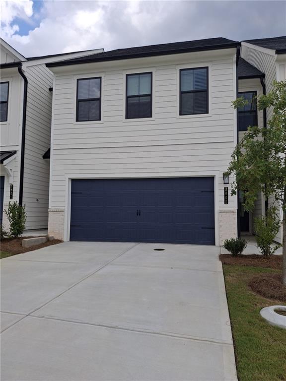READY NOW! A MUST SEE TOWNHOME IN FAST SELLING GAINESVILLE! LOW HOA DUES! AMENITIES GALORE! Experience modern townhome living with The Sawnee, a spacious 3-bedroom, 2.5 bathroom floor plan spanning 1,855 square feet. Designed for comfort and convenience, this home features an open-concept layout, seamlessly connecting the kitchen, dining, and family room ideal for gatherings and everyday life. Step inside to find luxury vinyl flooring throughout the main level common areas, a cozy linear fireplace with shiplap accent, and a stylish kitchen featuring cabinets with crown molding. Blinds are included throughout the home, adding both style and convenience. Beyond your front door, enjoy access to exceptional community amenities, including 2 pools clubhouse, pickleball, tennis, walking paths, AND a gym in the clubhouse! Conveniently located right off the highway, this home is just minutes from Downtown Gainesville with many options for dining and shopping. 15 minutes from Lake Lanier and a sports complex right in the front of your community! With its modern design, premium finishes, and prime location, The Sawnee is the perfect place to call home! PLEASE ASK ONSITE AGENTS ABOUT OUR FINANCIAL OFFERINGS !