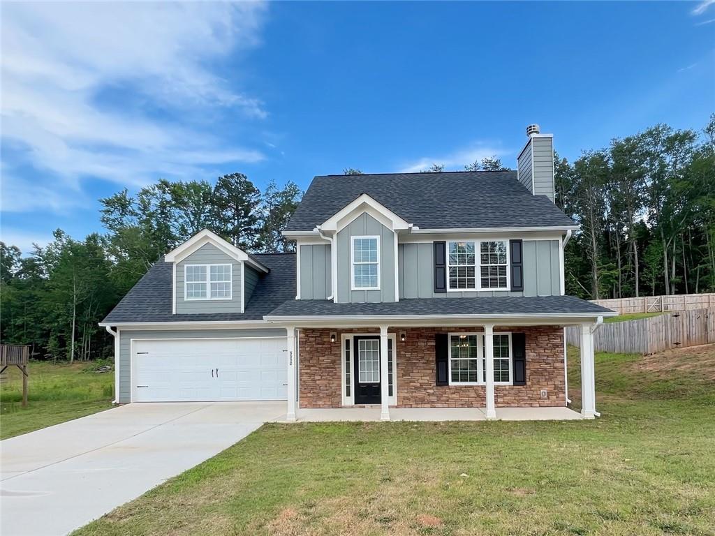 Welcome home to this beautifully maintained 4-bedroom, 2.5-bath residence at 5332 Lawson Lake Drive in Gainesville, GA. This spacious home offers a bright, open floor plan featuring a generous living area, open-concept kitchen, separate dining room, and convenient main-level laundry. Upstairs, you'll find four large bedrooms, including a spacious owner’s suite with a walk-in closet and a private bath complete with a combo soaking tub and shower. The additional three bedrooms share a full hall bathroom, perfect for family or guests. Step outside to enjoy a large backyard ideal for relaxing or entertaining. Located just minutes from downtown Gainesville, Lake Lanier, local parks, shopping, dining, and Northeast Georgia Medical Center, this home combines comfort with convenience. Call to schedule your tour today.