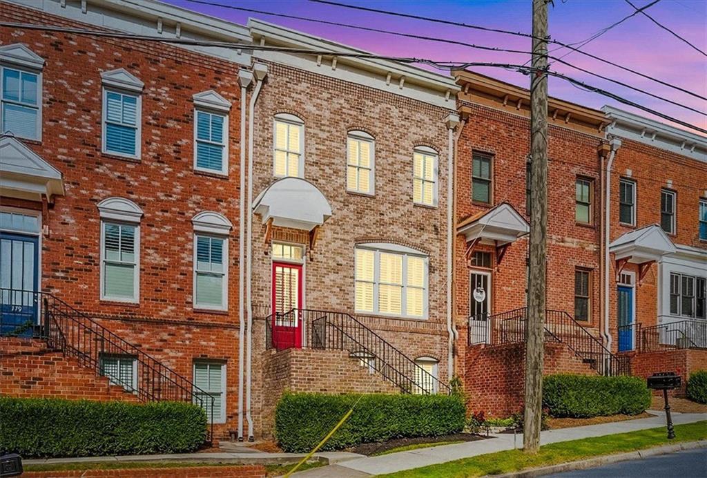 PLEASANT WALK through a charming residential neighborhood to the restaurants, breweries, shops, concerts, festivals, and farmers markets of Historic Marietta Square from your gorgeous, large, three-story Brownstone townhouse at 183 Cole Street NE.
This beautifully upgraded 4-bedroom, 3.5-bath home offers the perfect balance of modern comfort and timeless style. Inside, you’ll find a versatile flex space, 12-foot ceilings, freshly painted interiors, pristine hardwood floors, and custom plantation shutters. The gourmet kitchen with brand-new stainless appliances, granite countertops, and oversized island flows seamlessly into the light-filled family room with fireplace. High ceilings, open space, and elegant finishes make this home perfect for entertaining.
Upstairs, spacious bedrooms with new carpet (2024) and beautifully appointed baths provide comfort for family and guests. The terrace level adds flexibility with new LVP flooring (2024), ideal for a media room, office, guest or in-law suite.
Step outside onto the rebuilt deck (2024) with pergola covering, where you can enjoy views of the community gardens, green space, and fire pit.
You’ll appreciate thoughtful details like an efficient HVAC system with custom baffles, a new stacked washer/dryer, new water heater, visitor parking, and the peace of a dog friendly neighborhood bordering Marietta’s historic district.
?With 4 bedrooms and 3.5 baths, there’s plenty of room to welcome family and friends who will want to share in your new adventure.
See you at the Square.
