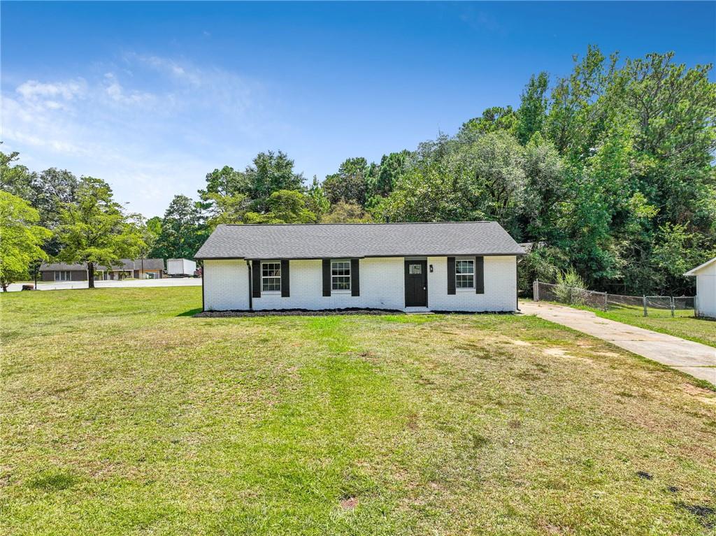 WELCOME HOME!! Renovated top to bottom 3 bedrooms 2 bathrooms with a flat front and back yard! As you walk in you'll notice the new paint throughout, new floors throughout and light filled living room! Overlooking the living room is the fully UPDATED kitchen including quartz countertops, stainless steel appliances, island perfect for entertaining, and white shaker cabinets! Master bedroom is a great size with its own master suite bathroom with new walk in shower & new vanity! Other two bedrooms are great sized and share a hallway bathroom with tub/shower combo and new tile and vanity!! Yard is super useable and perfect for kids pets and a garden! 5 minutes to Kroger, Lidl, CVS & Costco + Sams club! Chick fil a 6 minutes away!!