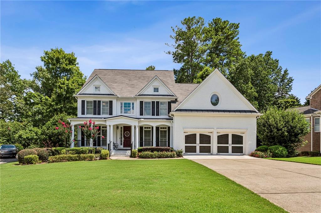 Welcome to this beautifully renovated 5-bedroom, 4.5 bath single-family home nestled in the prestigious Woodmont Golf and Country Club in Canton, GA. Offering the perfect blend of luxury, functionality, and serene outdoor living, this home is move-in ready and packed with upgrades. Formal living and dining rooms to tastefully accomodate all your guests. Step inside to discover a fully updated kitchen featuring premium finished, high end stainless steel appliances and white custom cabinetry-ideal for everyday living and entertaining. The spacious master suite with sitting area includes a luxuriously renovated en-suite bath with designer stand alone tub designed for relaxation and style. Ample room for all your wardrobe in the oversized master closet. A large bonus room provides the perfect flex space for a media room, playroom, excercise room or home office. The daylight basement includes a finished in-law suite complete with a kitchenette and private entrance for guests or multigenerational living. The expansive basement also includes a special childrens playroom, designed by the owners artistry to make you feel like your at Disney World, and additional storage space. Enjoy the outdoors from the screened porches, deck or the under decking patio, all overlooking a large, fenced wooded backyard with private trails-a nature lover's dream. Located on a quiet street within the vibrant Woodmont community, this home offers access to top-notch amenities including golf, swim, tennis and clubhouse. All within a short drive to shopping, dining and top-rated schools. Don't miss this rare opportunity to own a renovated gem in one of Canton's most sought after neighborhoods!