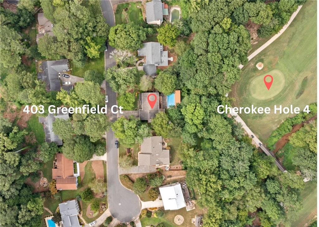 GOLF COURSE LOT WITH A POOL ON CHEROKEE HOLE 4! While this home is move-in ready, it also presents a fantastic opportunity for those eager to add their personal flair and modern updates. With solid bones and classic features throughout, you’ll find the ideal canvas to create your dream haven. When you enter the home, you are greeted by a large living room and a separate dining room offering plenty of space for entertaining or relaxing. The highlight of the kitchen is the large 6 burner gas range with double ovens and vent hood. The kitchen offers easy access to the swimming pool. The kitchen flows seamlessly to the family room and there is a main level bedroom and full bathroom. Upstairs has 4 spacious bedrooms. The oversized primary bedroom features vaulted ceilings and provides a peaceful retreat. It is hard to find bedrooms as large as the 3 secondary bedrooms with ample closet space. There are 2 large walk-in closets that may provide the opportunity to add a third full bathroom on the upper level. Enjoy sweeping golf course views from the screened in porch and deck overlooking the swimming pool. There is plenty of space to entertain indoors and outdoors in the backyard oasis. Perfect for those seeking both value and location, this property invites you to reimagine, renovate, and truly make it your own.