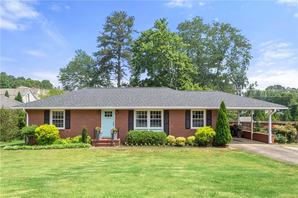 Welcome home to this beautiful, very well-maintained ranch in the heart of Marietta. Absolutely no to-do list here, move in and start enjoying all the vibrant living that historic Marietta has to offer. A quick, roll, stroll or walk gets you to the Square with all the concerts, entertainment, restaurants, farmers' market, and shops. Hiking, fitness opportunities, and running trails are everywhere! Four-sides brick, hardwood floors throughout with tile in kitchen and baths, new, insulated windows installed 6-23, roof, hvac with dehumidifier and purifier, ductwork, including returns to each room, all about three years old. Tankless water heater adds to your comfort level. Gorgeous lot entices you outside to entertain, play or even work, covered patio extends your living, play and entertaining options. Beautiful, low maintenance landscaping, wide open lawn area and relaxing covered patio make for perfect weekends! Mead Indoor emptied, sanitized, sealed, and insulated the attic and crawl space.