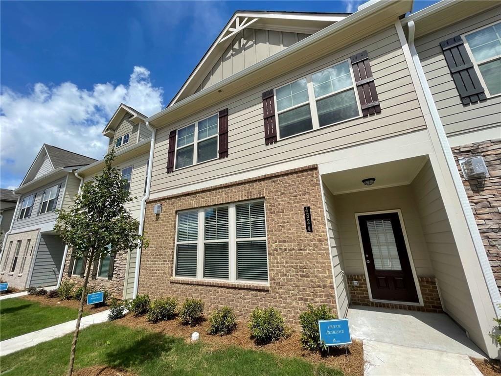 Beautiful, open concept townhouse available in the coveted Berkeley Township subdivision! Close to in-town living, home features great living area with hardwoods, granite countertops, stainless steel appliances, all with a huge island in kitchen area. Brand new luxury flooring and brand new carpet throughout. Upstairs has plenty of rooms and space with a owners suite featuring a separate tub and shower with a landing area for additional living area. Laundry room upstairs and more. Spacious townhouse. Berkeley Township offers easy access to Peachtree Square Shopping Center and Peachtree Parkway. Beautifully built and available now!