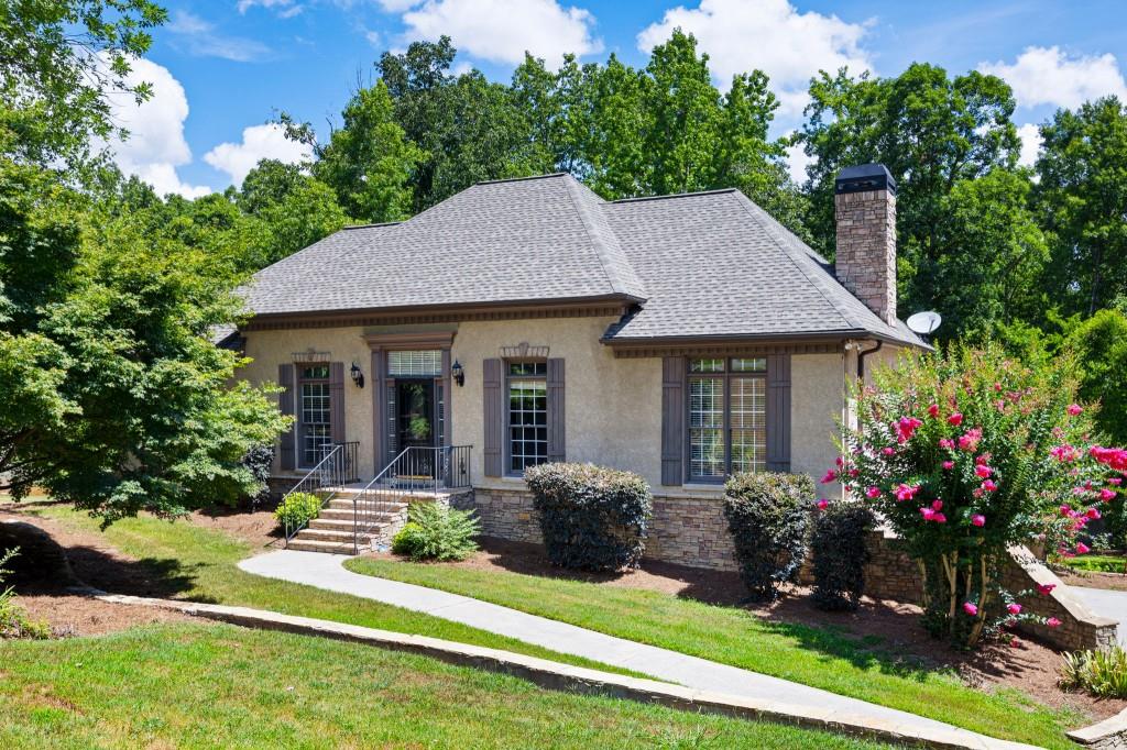 This charming home offers a perfect blend of comfort, style and functionality. With a thoughtfully designed layout this residence meets the needs of today's family while providing cozy spaces for relaxation and entertainment. Experience the convenience of having your primary suite on the main floor. This suite boasts a warm fireplace making it the perfect spot to unwind at the end of the day. The main level further offers 2 additional bedrooms, perfect for family or guests along with 2 full bathrooms. There is also a Functional flex room whether you need a home office or a cozy reading nook. This versatile flex room allows for endless possibilities. The heart of the home is the inviting family room featuring a brick fireplace that serves as a focal point for gatherings. This open concept space flows effortlessly into the eat in kitchen as well as the separate dining room creating a seamless environment for entertaining family and friends. The partially finished basement expands your living space with a large family/game room perfect for movie nights or game days. You will also appreciate another bedroom and full bath perfect for your teenager or overnight guests. Step outside to your outdoor oasis. The expansive deck invites you to bask in the sun or host summer barbeques. The patio area features an enchanting fireplace perfect for an evening under the stars. And don't forget the serene koi pond adding a touch of tranquility to your outdoor experience. So, whether your sipping coffee on the deck or hosting gatherings around the fire this home is designed for living life to the fullest.