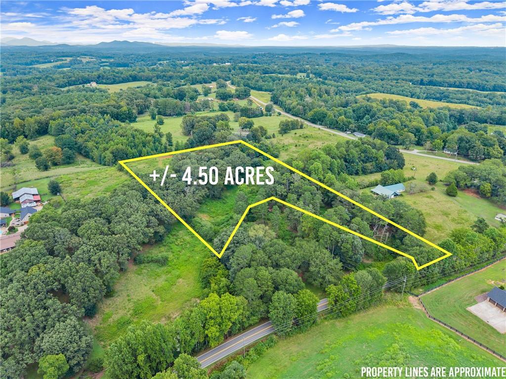Build Your Dream Home on 4.5 Scenic Acres in North Hall!
Welcome to your future homesite—4.5 beautiful, buildable acres located in the highly sought-after North Hall School District. Nestled just off Clarks Bridge Road, this private tract offers the perfect blend of convenience and seclusion. Enjoy quick access to Lake Lanier’s Olympic Rowing Venue and the nearby Boathouse Community Venue, making it ideal for water enthusiasts and outdoor lovers alike. This gently rolling property provides multiple options for your dream home layout—whether you’re envisioning a stately modern farmhouse, a custom brick estate, or a quiet country retreat. With plenty of room for a pool, workshop, or even a small hobby farm, the possibilities are endless. Enjoy peaceful surroundings with mature trees and a natural landscape, all within minutes of Gainesville, shopping, dining, and North Hall community amenities. Rare opportunity—acreage like this doesn’t come around often in such a prime location. Schedule a drone tour today!