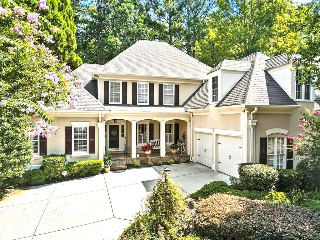 Welcome to Gleneagles Points_ Windward subdivision! This elegant and beautiful appointed home, located on a quiet street, safety area in Windward features a bright, open floorplan. The primary suite on the main and a charming back deck with a pergola overlooking a stone pond and waterfall. Step through the front door to be greeted by natural light shining through the windows of the library, dining room and great rooms, all with hardwood floors and lovely architectural details. Just beyond the statement fireplace in the great room, you will find a cheery kitchen offering bright white cabinetry, stainless steel appliances, granite counters and a large peninsula overlooking the breakfast area and family room. The primary suite located on the main, offers spacious accommodations and elegant details such as trey ceiling and bay windows. The connected bath features a large frameless shower, a large white vanity with dual sinks and ample storage, plus a separated water closet. Upstairs, a lot connects three second bedrooms, one perfect for a bonus room or office, plus a large bathroom for families guests. The private, fenced backyard provides a tranquil oasis with its stone paths, large deck, pergola, stone pond, and waterfall, all of which are surrounded by a elegant landscaping. In addition to all this home offers, residents of Windward also enjoy neighborhood amenities such as soccer and baseball fields, walking trails, pavilions and playgrounds. The community is also home to the Windward Lake Club and Golf club of Georgia. Near GA 400, Avalon, Halcyon shopping, dining and located in a top rated school