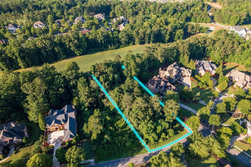 Welcome to your dream golf course lot in the prestigious Governors Towne Club, located in Acworth, Georgia.
This exceptional homesite backs directly onto the 8th fairway of a world-class 18-hole golf course, masterfully designed by two-time U.S. Open Champion Curtis Strange—a true paradise for golf enthusiasts.
Governors Towne Club is an exclusive, 24/7 gated community offering resort-style living at its finest. Residents enjoy access to an impressive array of amenities, including: A full-service clubhouse ideal for hosting events, State-of-the-art health and fitness center, Day spa, Three on-site restaurants, Aquatic center with competition pool, Children’s splash park and waterslide playground, Tennis courts with pro shop,Pickleball, basketball, and baseball facilities.
This is a rare opportunity to build your custom dream home on a spacious lot nestled within this luxurious setting. Please note: the sale is for the lot only. The building images shown are conceptual renderings provided by Elevation Building Company, one of the community’s premier homebuilders.
A club membership is required and a one-time initiation fee of $30,000 is included in the sale price. Golf memberships are also available. Buyer and Buyer's Agent shall verify all Homeowners Association (HOA) pertinent information.
Seller is highly motivated. Bring all offers to the table.
I’d be happy to personally walk you through the property.
Schedule your private tour today